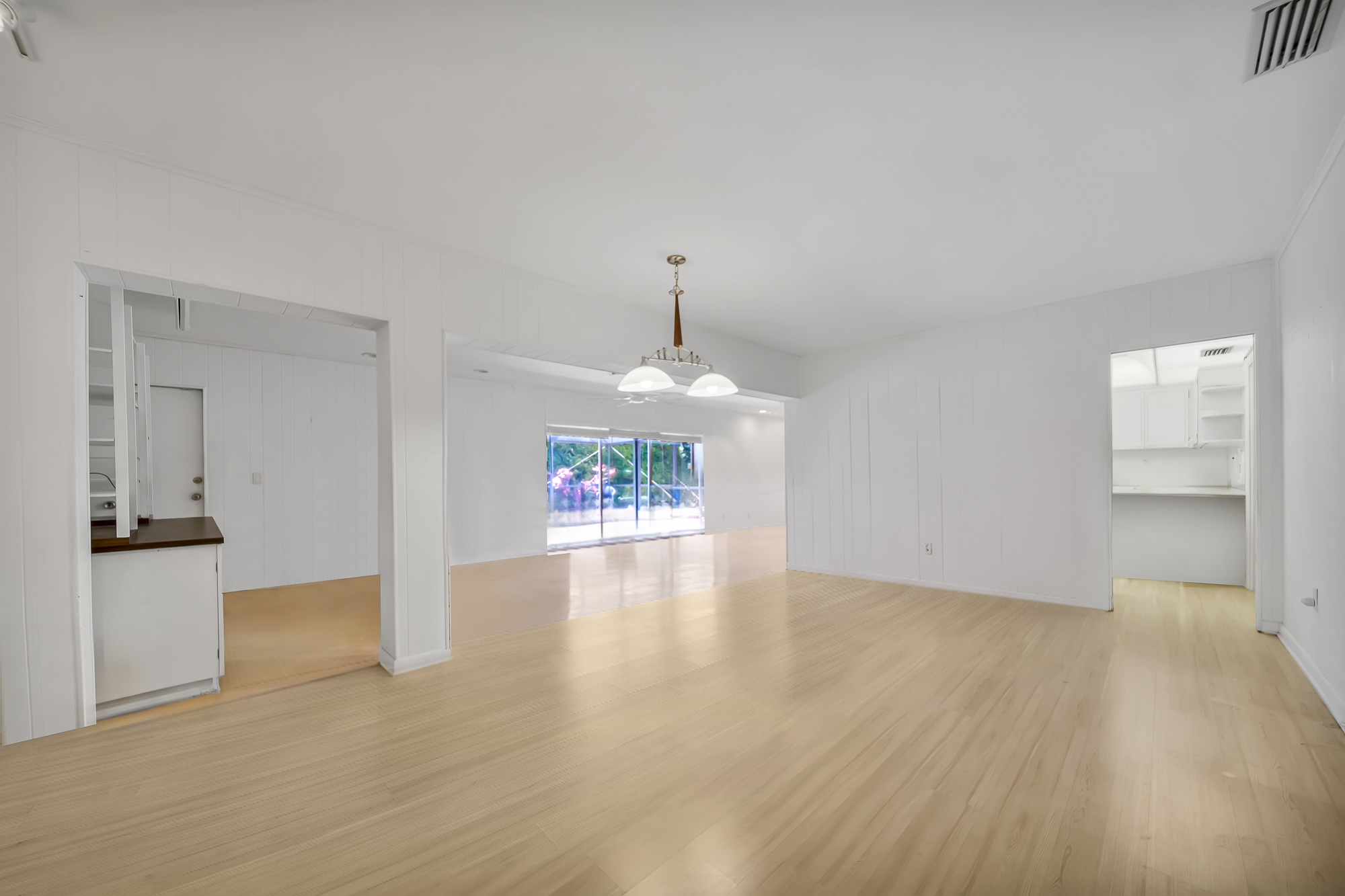6760 Southwest 62nd Terrace Miami, FL 33143 - Photo 24 of 38 a view of an empty room with window and cabinet