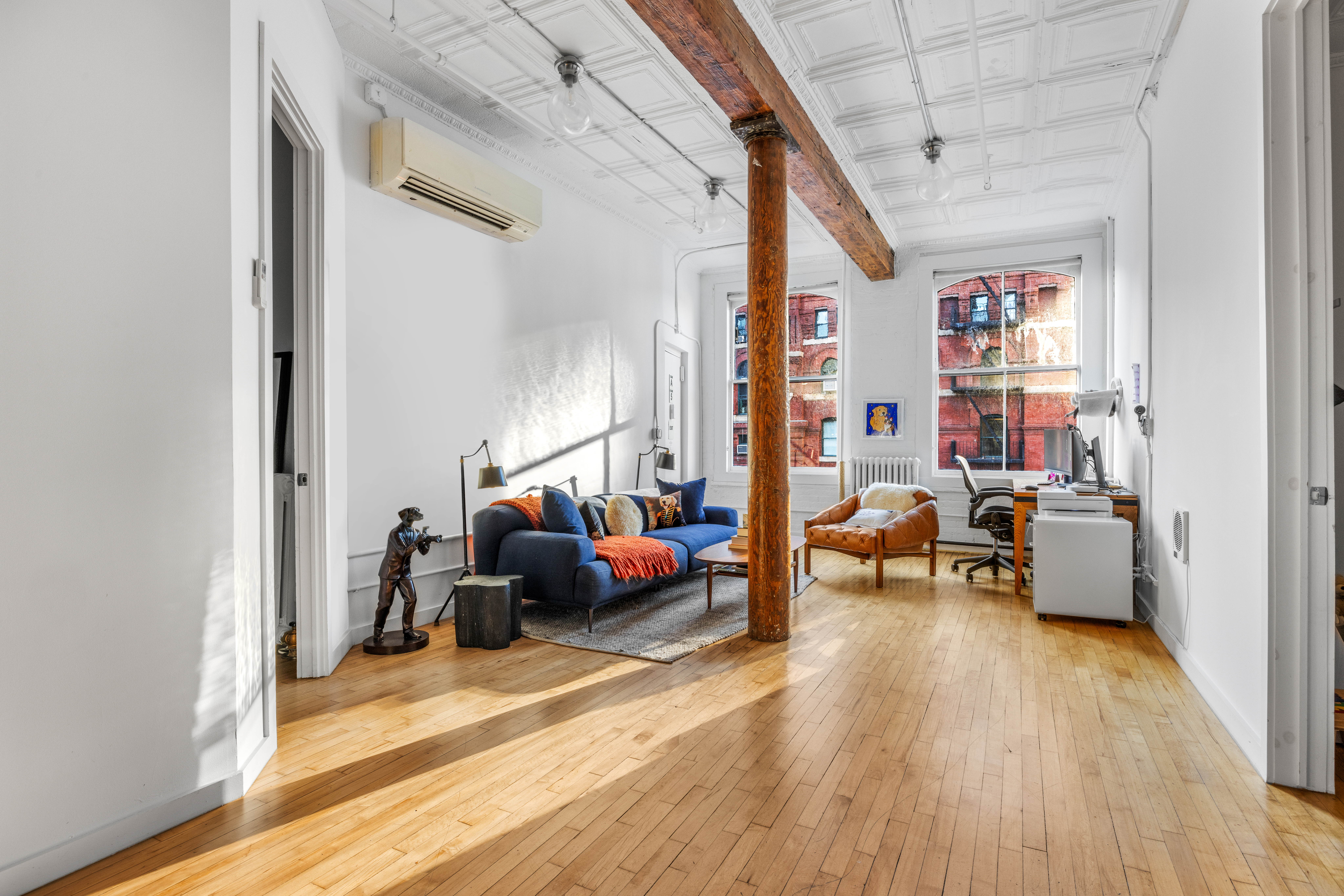 5 White Street, Unit 5B Manhattan, NY 10013 - Photo 16 of 21 a living room with furniture and a wooden floor