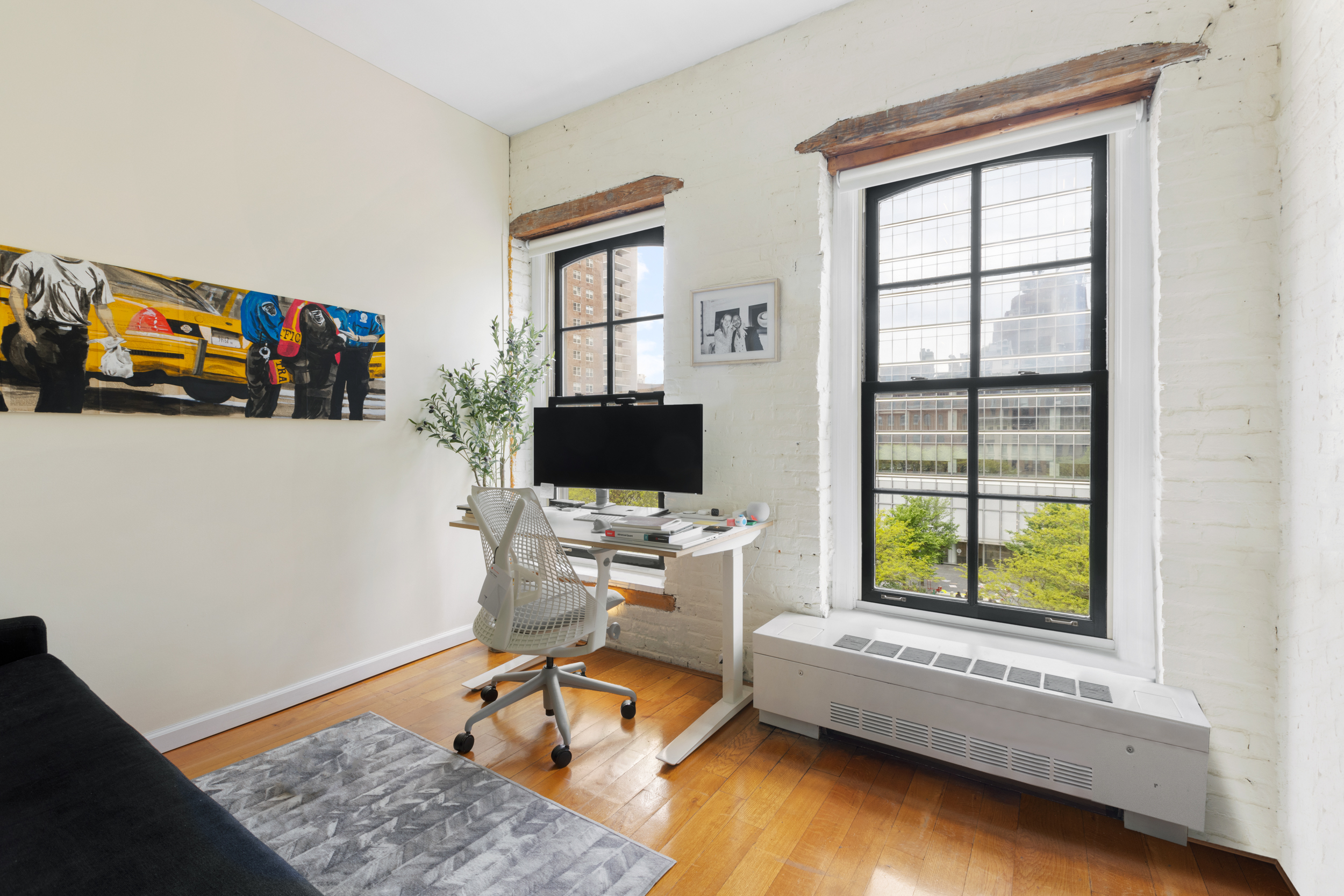 62 Beach Street, Unit 5E Manhattan, NY 10013 - Photo 12 of 15 a workspace with furniture and a window