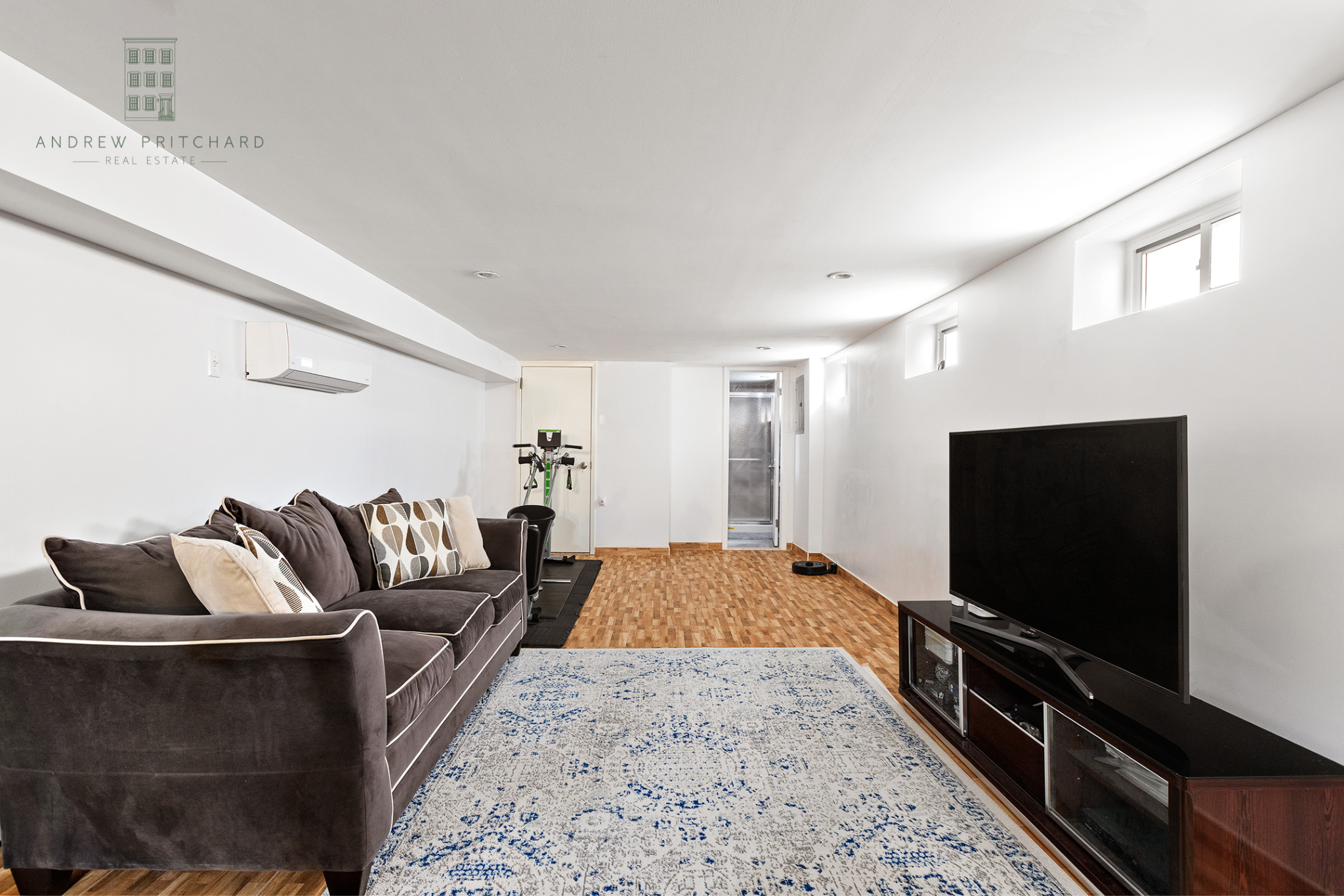 1140 78th Street Brooklyn, NY 11228 - Photo 5 of 12 a living room with furniture and a flat screen tv