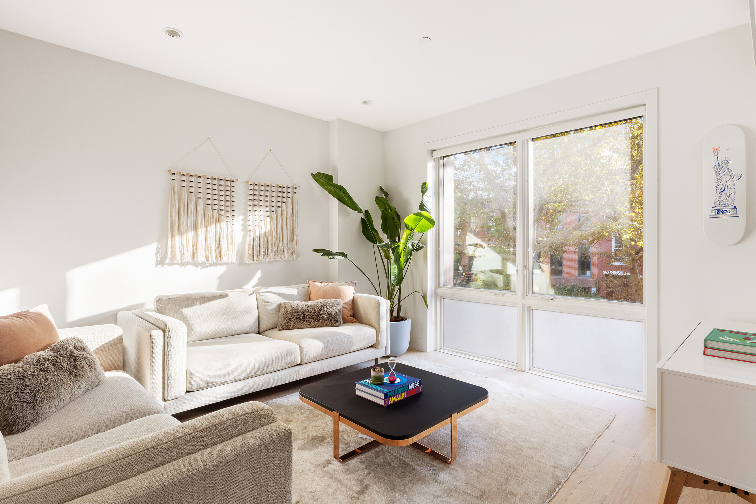 207 Wyckoff Street, Unit 2 Brooklyn, NY 11217 - Photo 2 of 15 a living room with furniture and a window