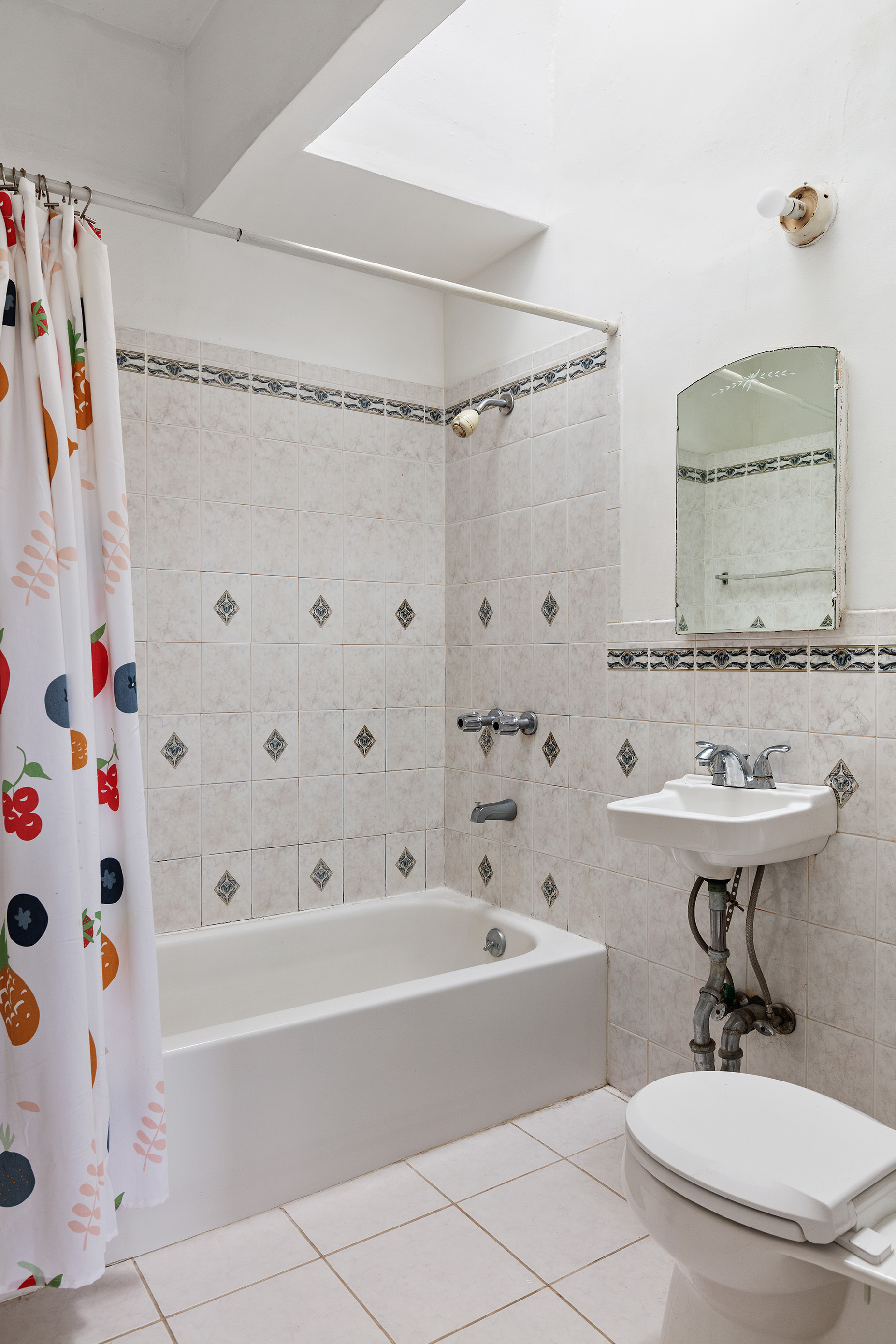 318 21st Street Brooklyn, NY 11215 - Photo 6 of 14 a bathroom with a sink a toilet and a bathtub