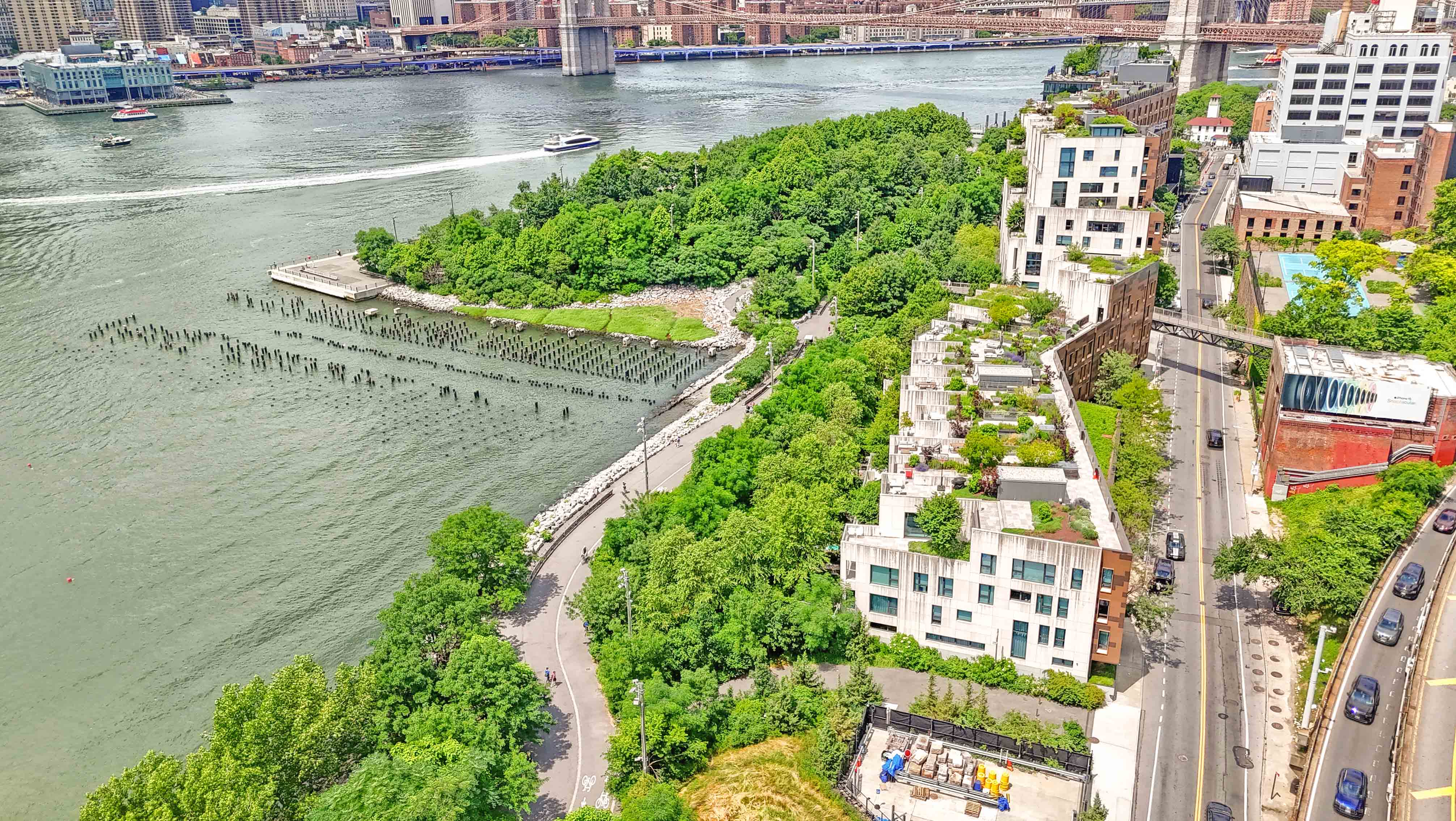 57 Montague Street, Unit 1D Brooklyn, NY 11201 - Photo 22 of 27 a view of a lake with a building and trees in the background