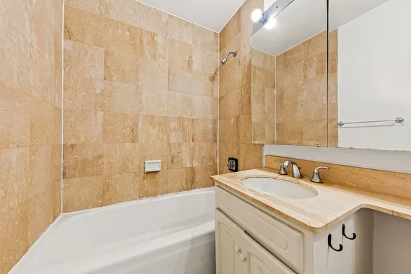 a bathroom with a sink and a bathtub