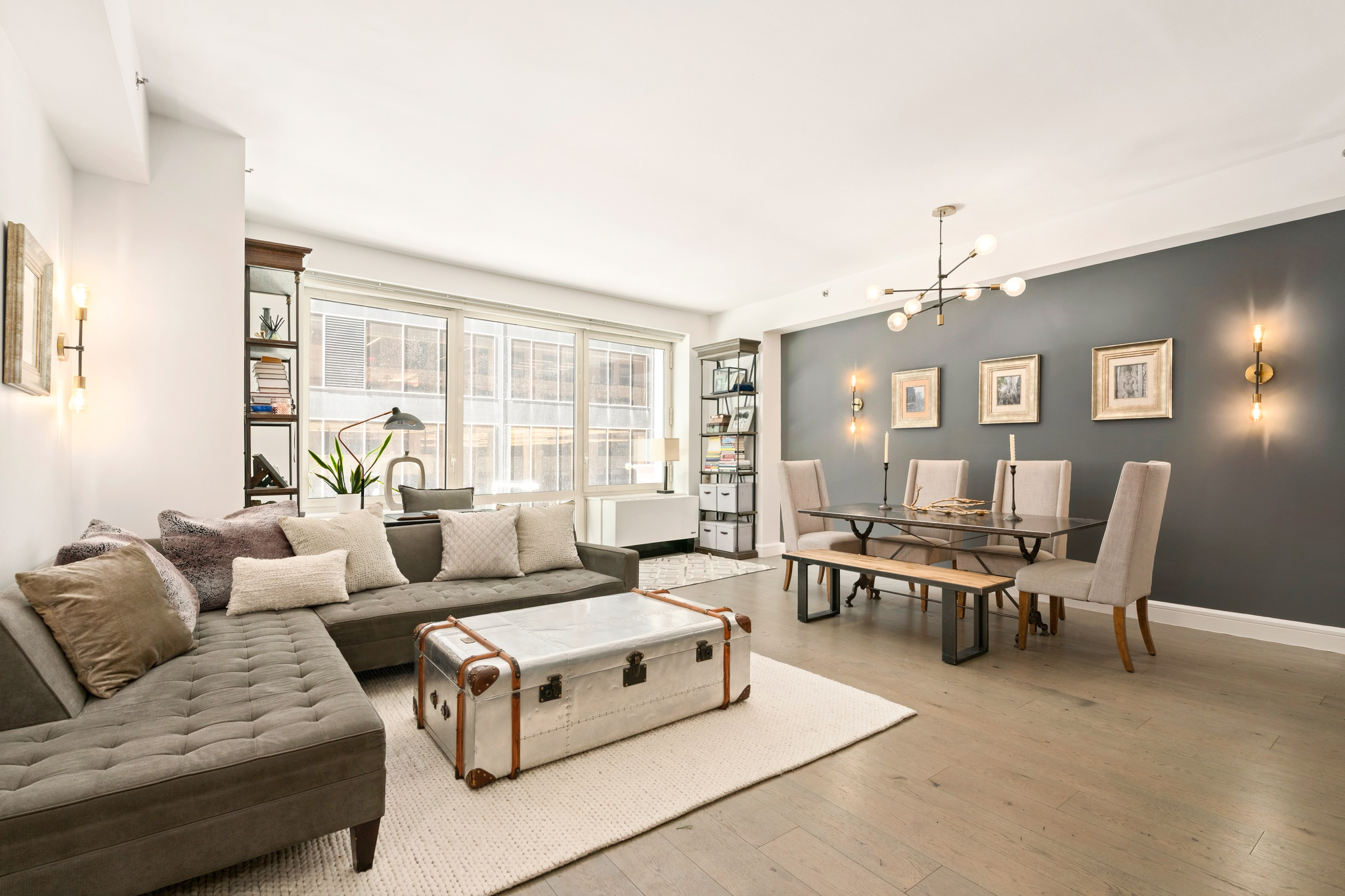 67 Liberty Street, Unit 3 Manhattan, NY 10005 - Photo 1 of 8 a living room with furniture and a large window