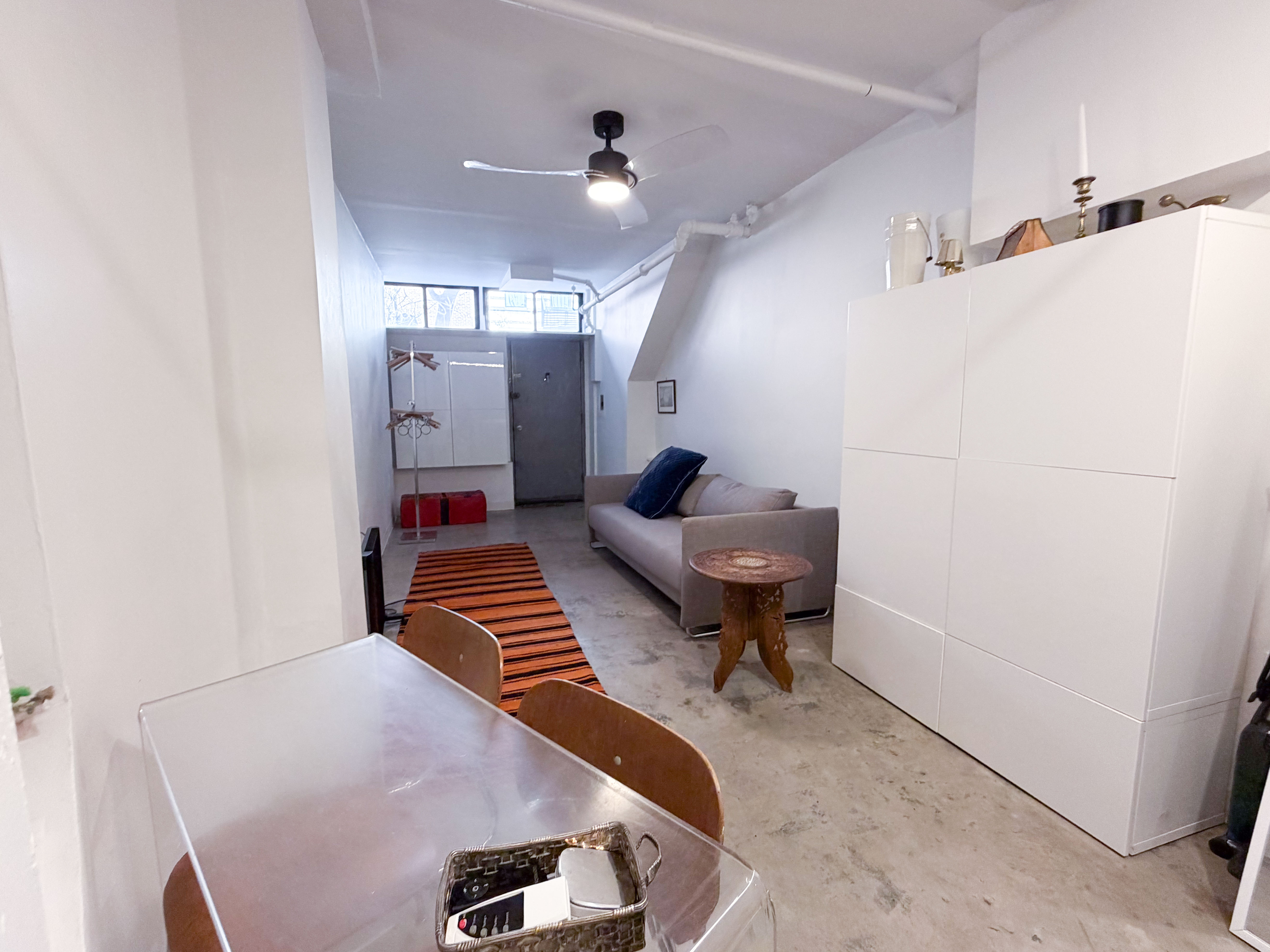 206 East 7th Street, Unit G Manhattan, NY 10009 - Photo 5 of 22 a living room with furniture and a piano