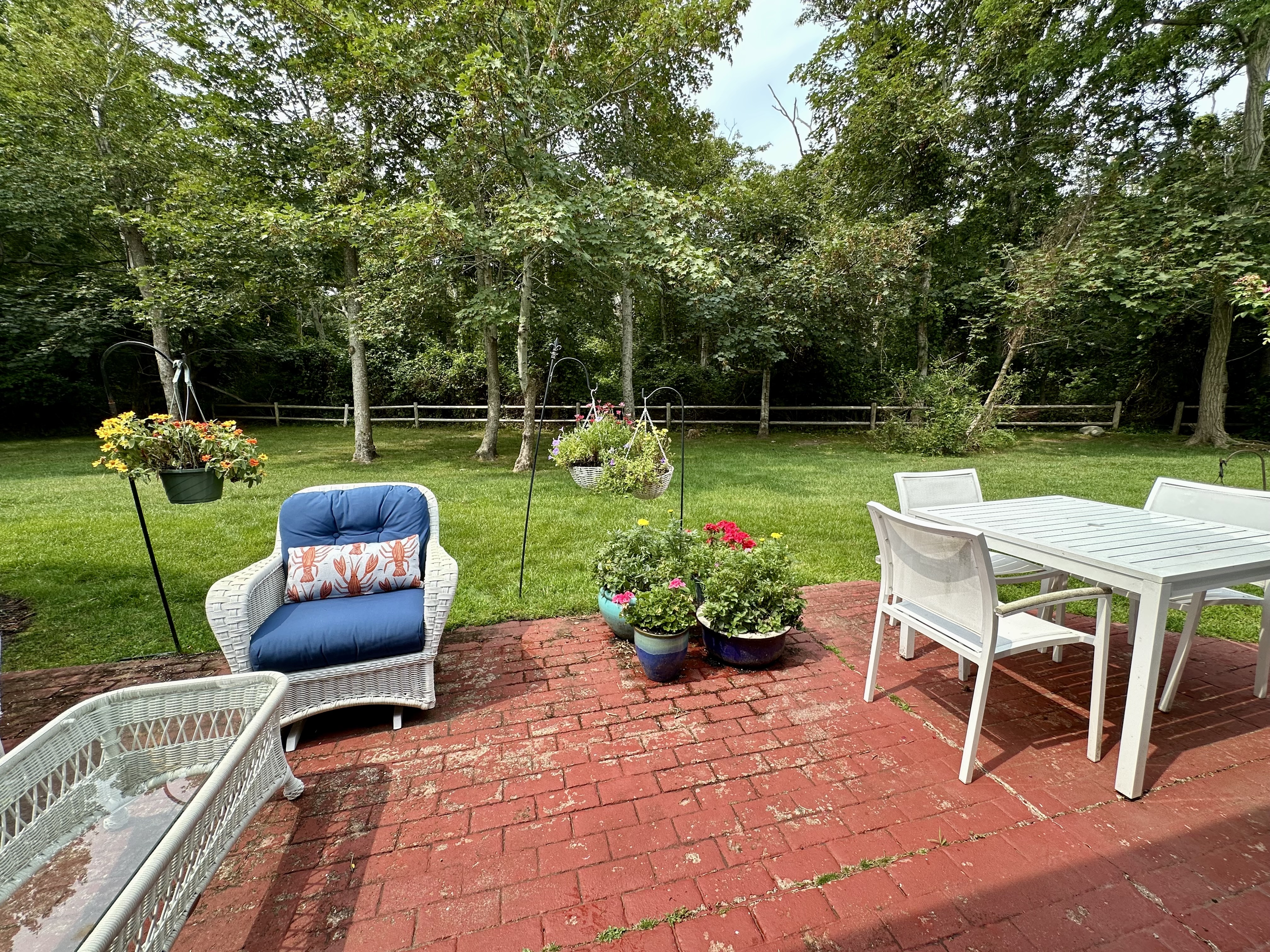 11 Juniper Circle Brewster, MA 02631 - Photo 16 of 29 a view of a chair and tables back yard of the house