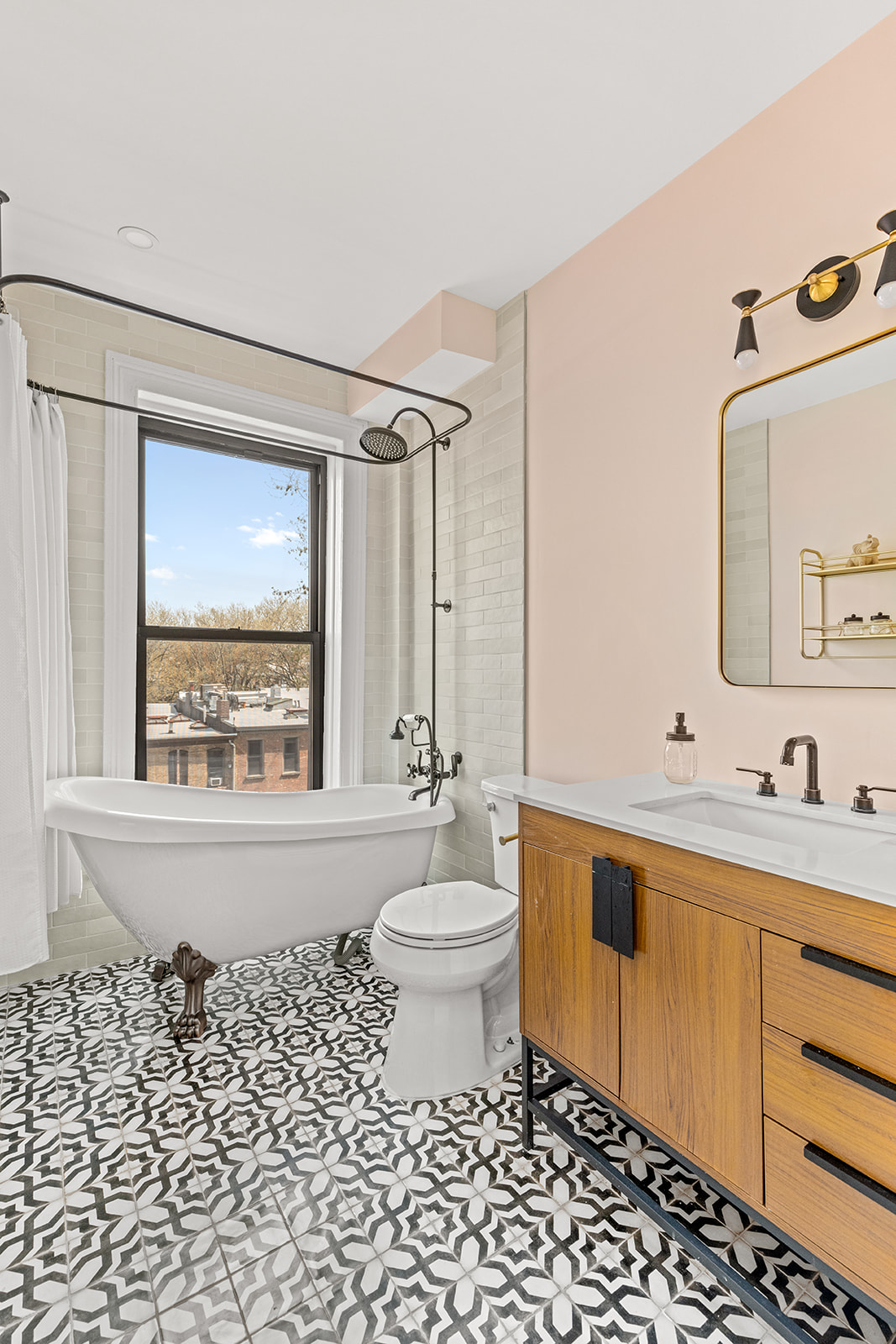 417 6th Street Brooklyn, NY 11215 - Photo 17 of 21 a bathroom with a bathtub sink mirror and toilet