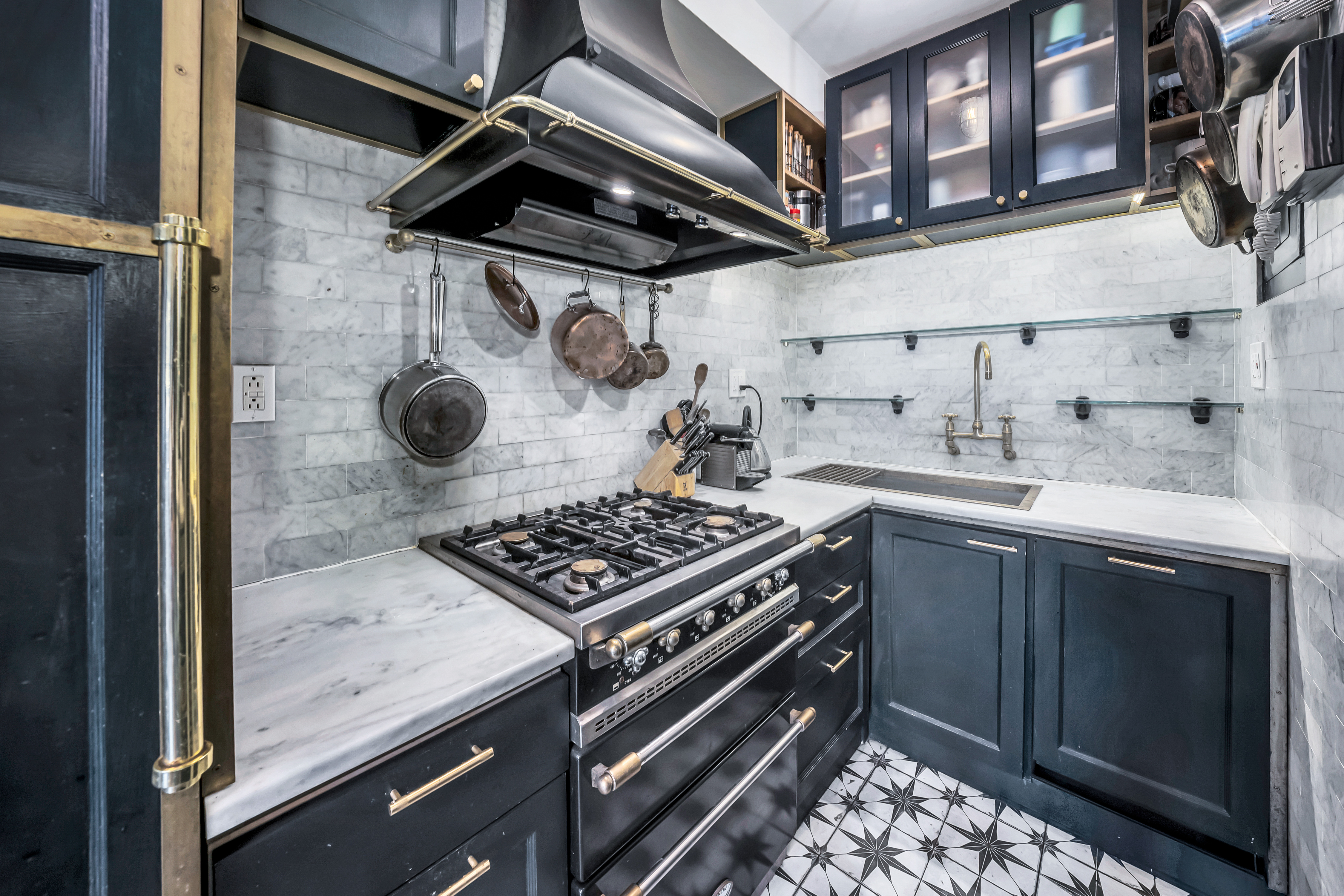 64 East 80th Street, Unit 4F Manhattan, NY 10075 - Photo 4 of 8 a kitchen with a stove and a sink