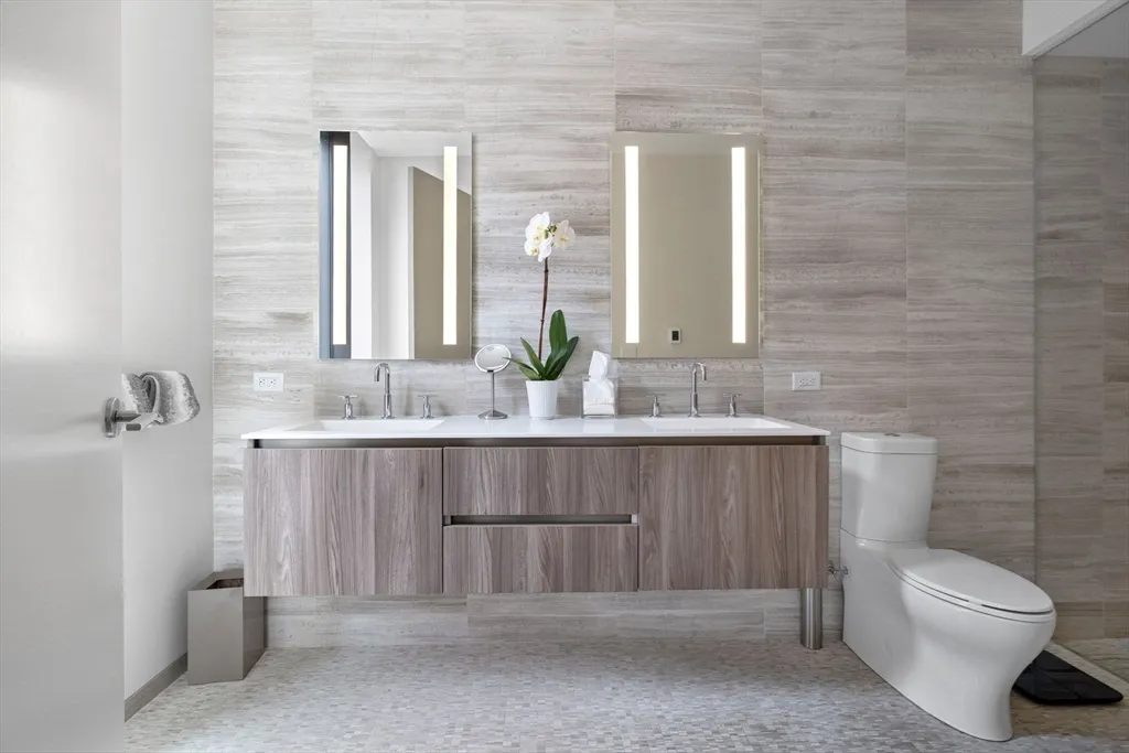 a bathroom with a granite countertop sink a shower and a mirror