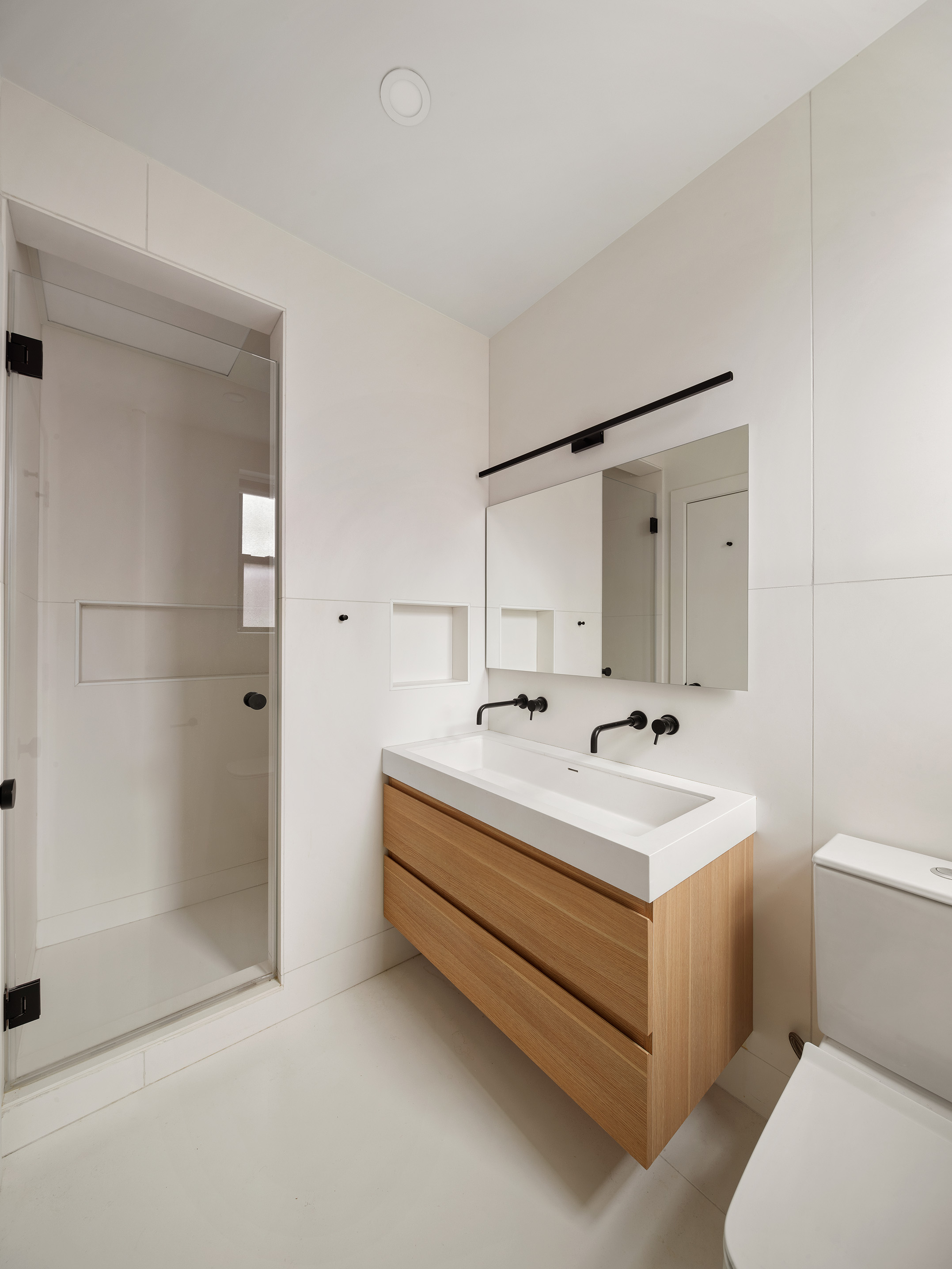 100 Ocean Parkway, Unit 4H Brooklyn, NY 11218 - Photo 8 of 11 a bathroom with a double vanity sink mirror and toilet