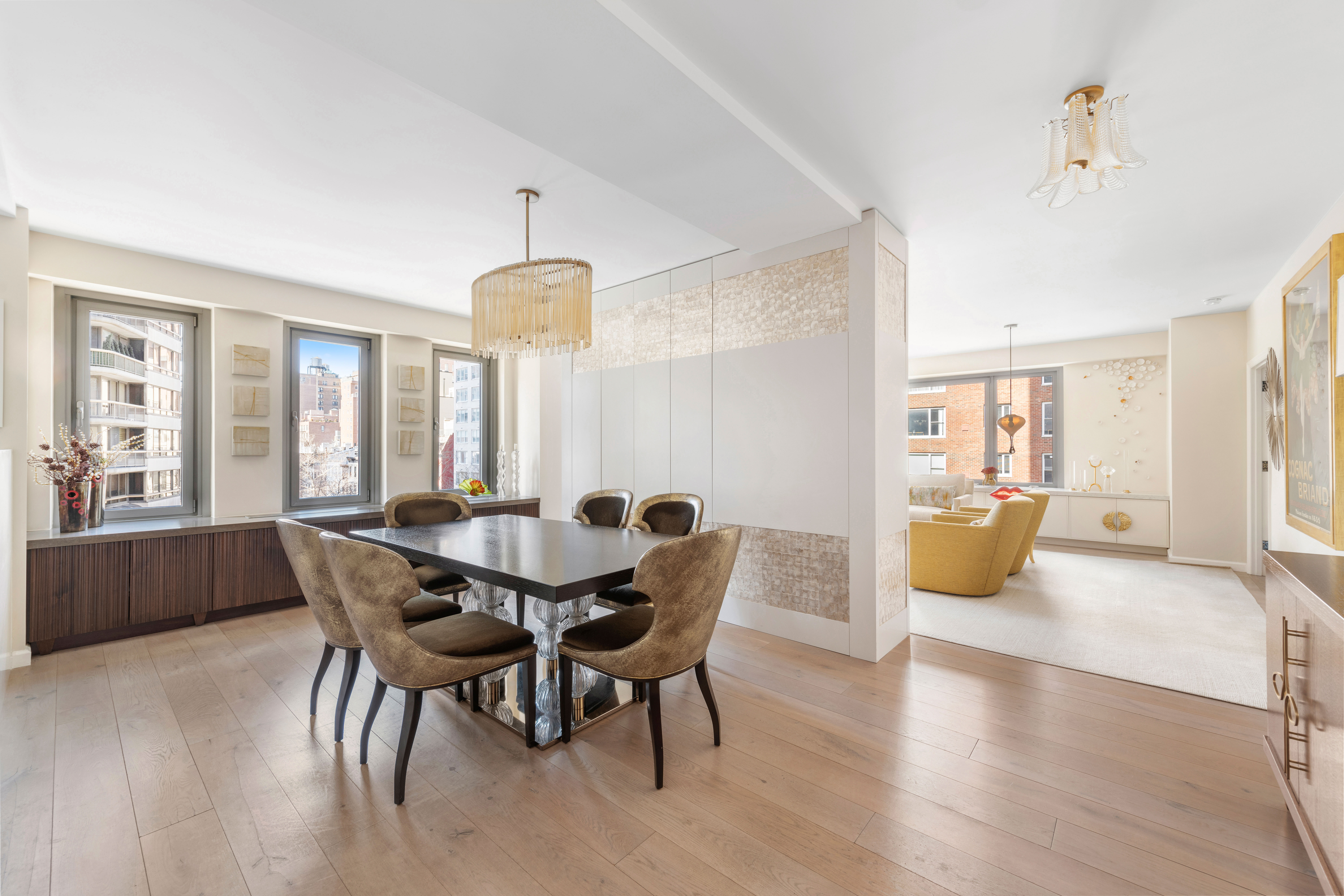 200 East 62nd Street, Unit 5A Manhattan, NY 10065 - Photo 8 of 25 a view of a dining room with furniture and wooden floor