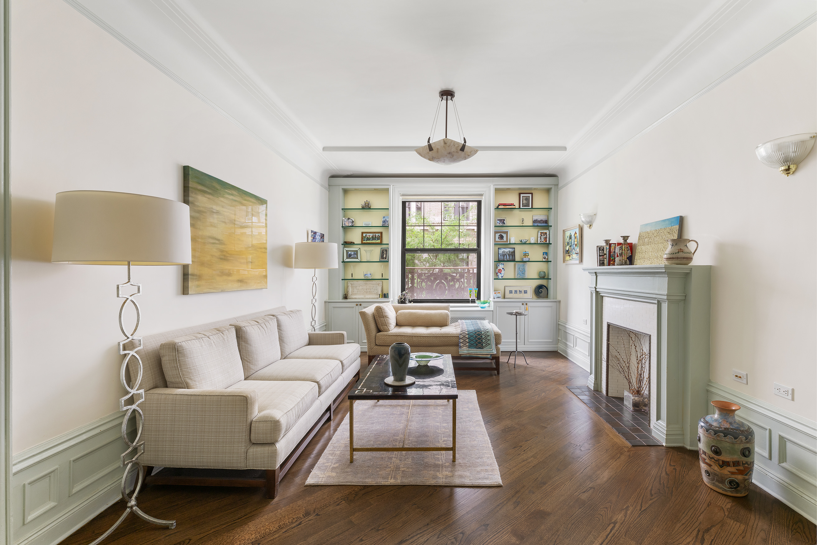 215 West 98th Street, Unit 3D Manhattan, NY 10025 - Photo 1 of 12 a living room with furniture and a fireplace