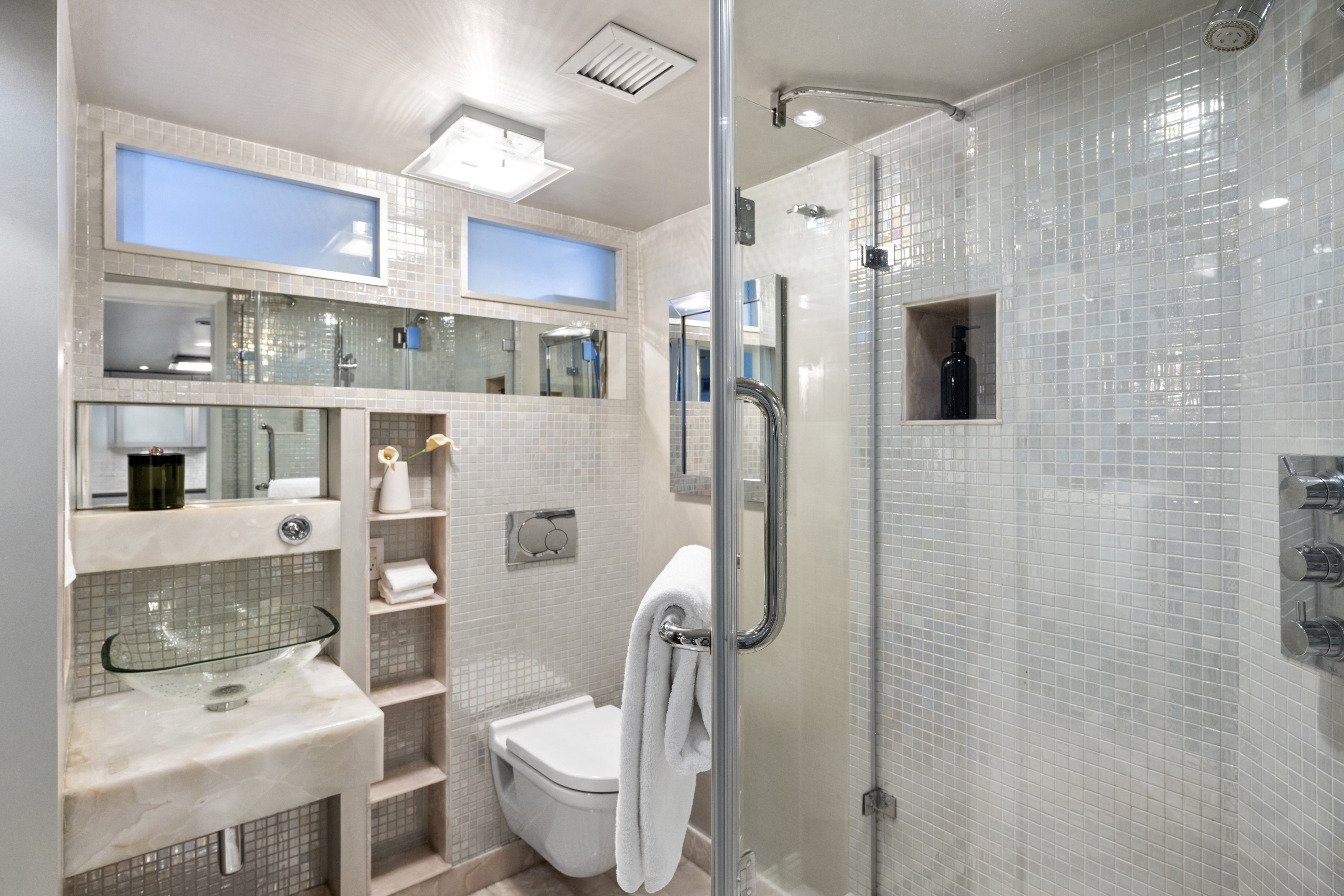253 West 73rd Street, Unit 6B-C Manhattan, NY 10023 - Photo 7 of 21 a bathroom with a sink toilet and shower