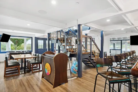 a view of a livingroom with furniture window and wooden floor