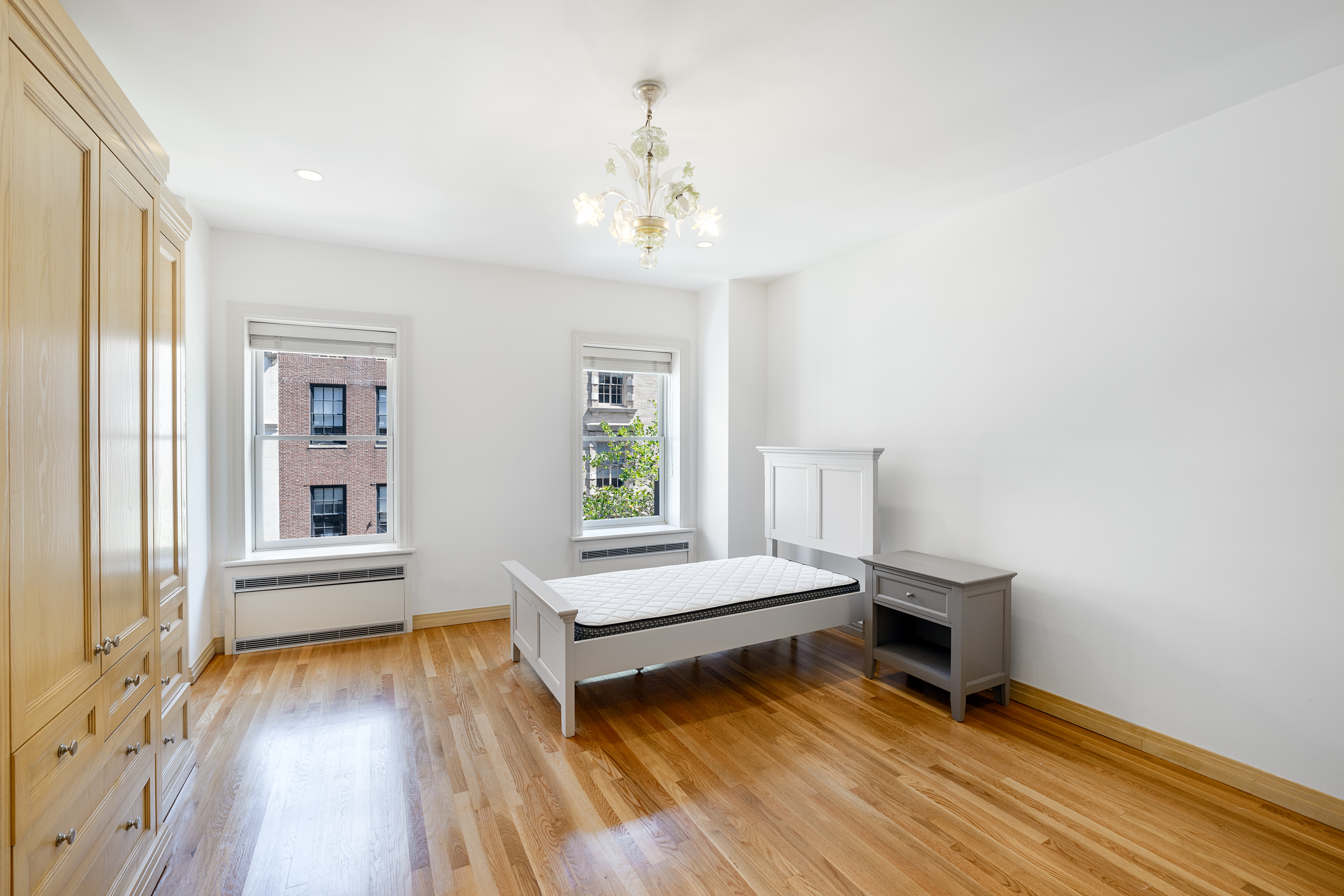 22 East 78th Street Manhattan, NY 10075 - Photo 18 of 23 a bedroom with furniture and a window