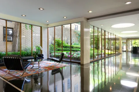 a outdoor space with furniture and floor to ceiling window