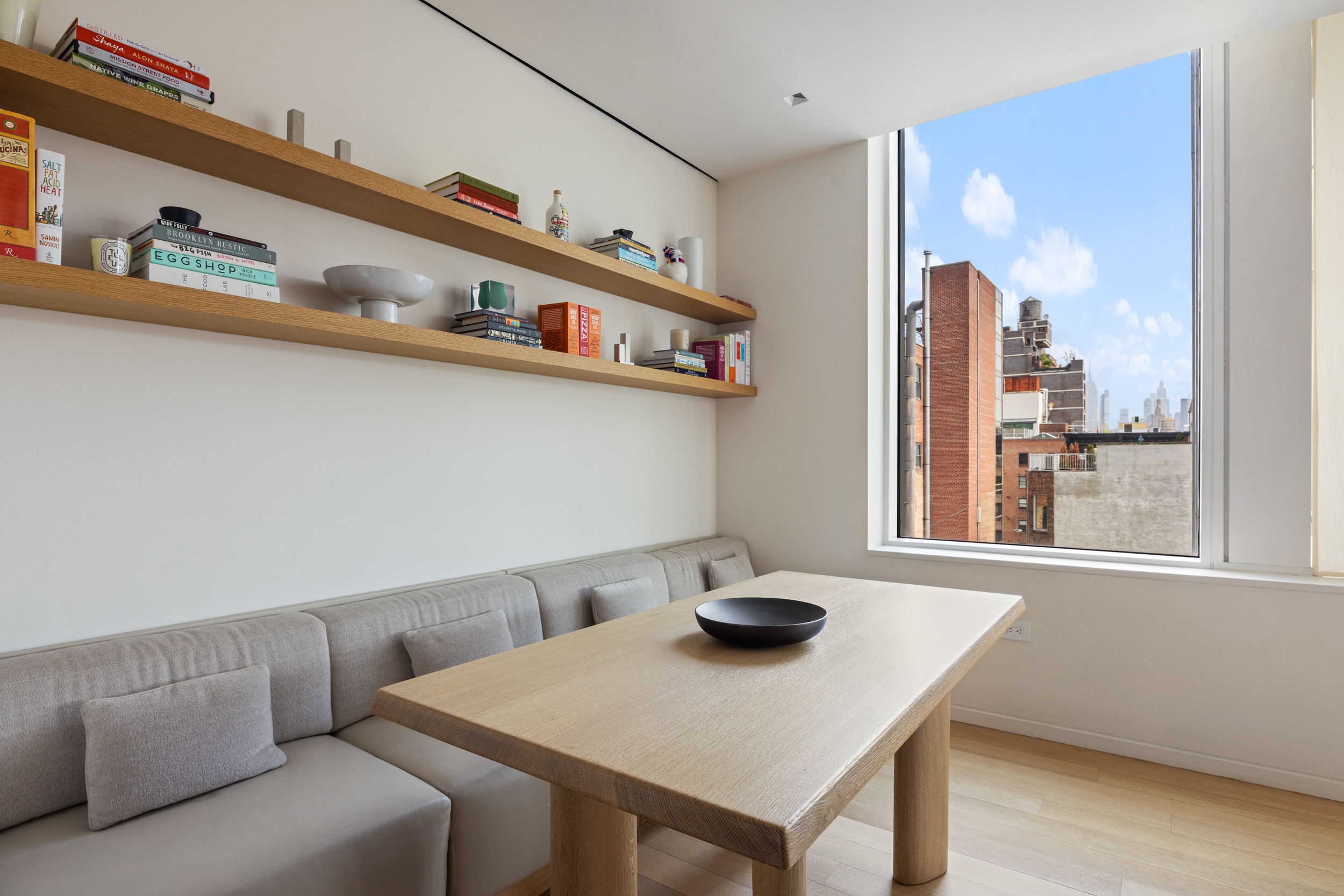 350 West Broadway, Unit 7FL Manhattan, NY 10013 - Photo 6 of 17 a view of a dining room with furniture and a potted plant