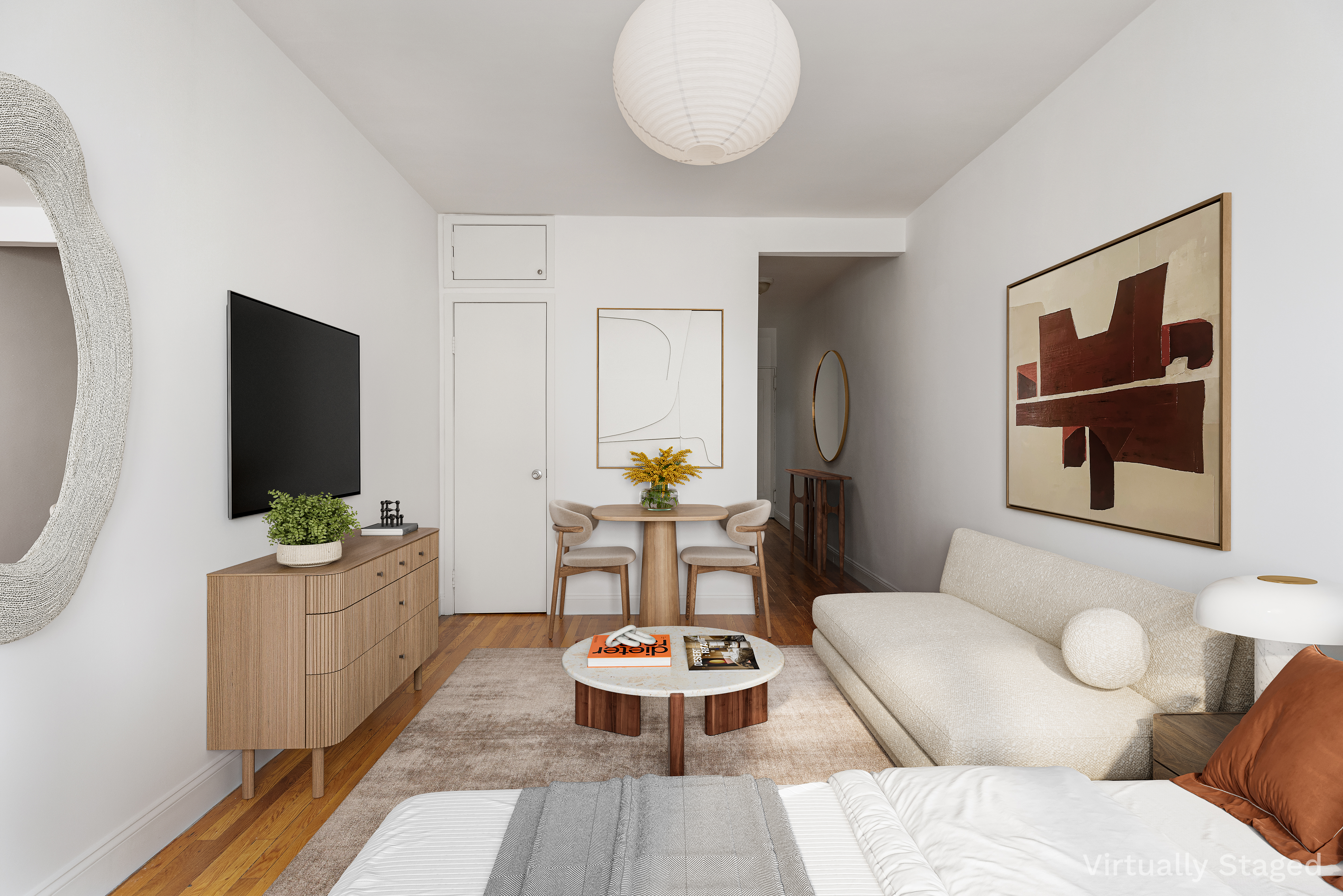 312 West 23rd Street, Unit 4G Manhattan, NY 10011 - Photo 7 of 12 a living room with furniture and a flat screen tv