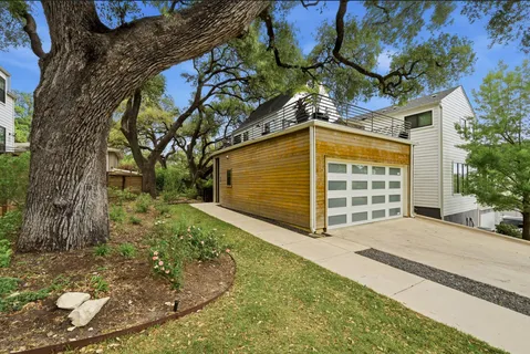 a view of a house with a tree