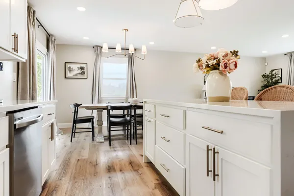 a view of a dining room with furniture and wooden floor