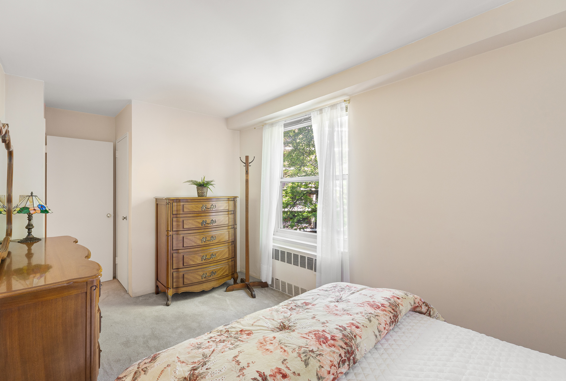 35-51 85th Street, Unit 4E Queens, NY 11372 - Photo 12 of 14 a bedroom with a bed and furniture