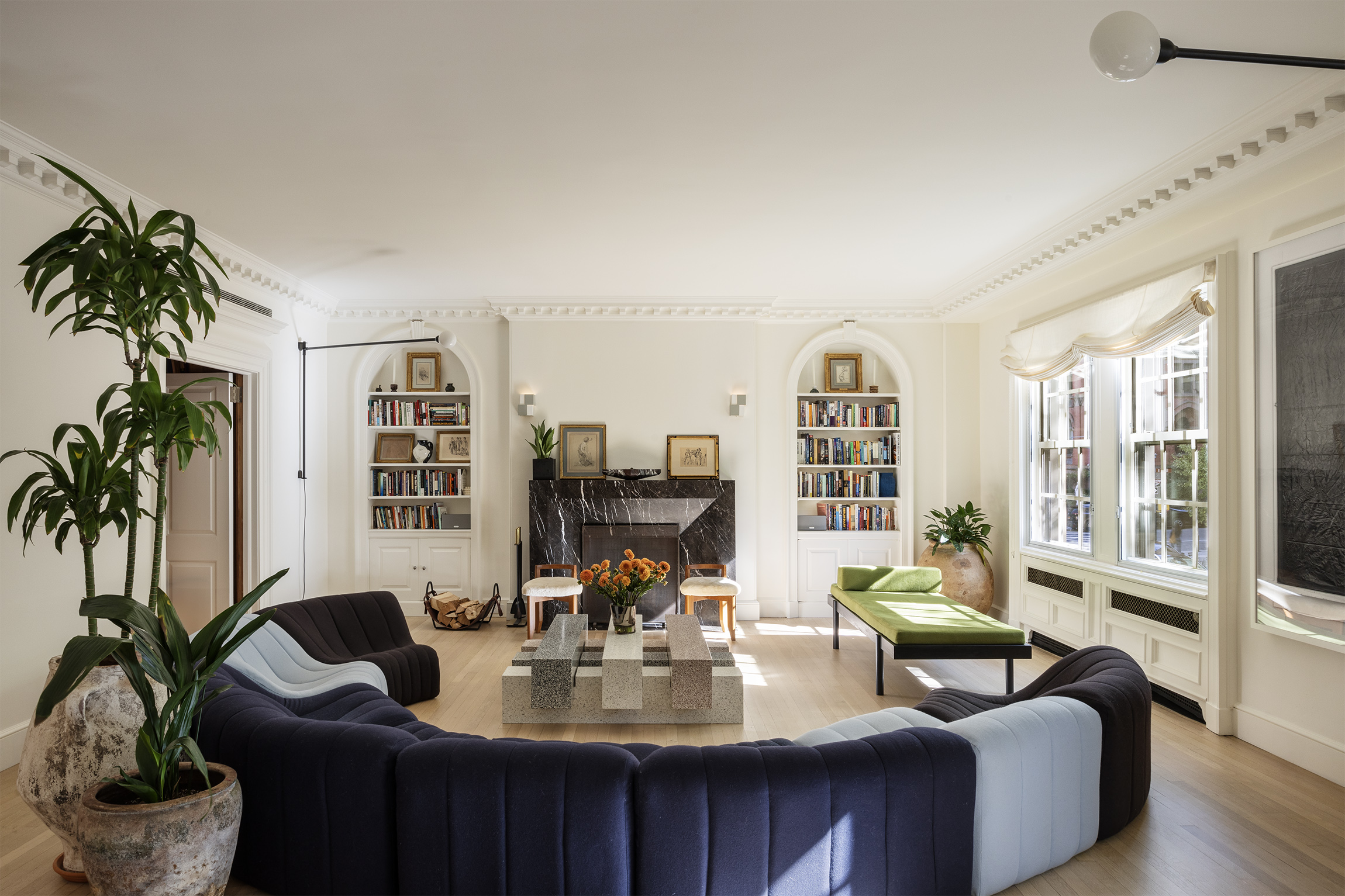 133 East 64th Street, Unit 2B Manhattan, NY 10065 - Photo 2 of 14 a living room with furniture potted plant and a large window
