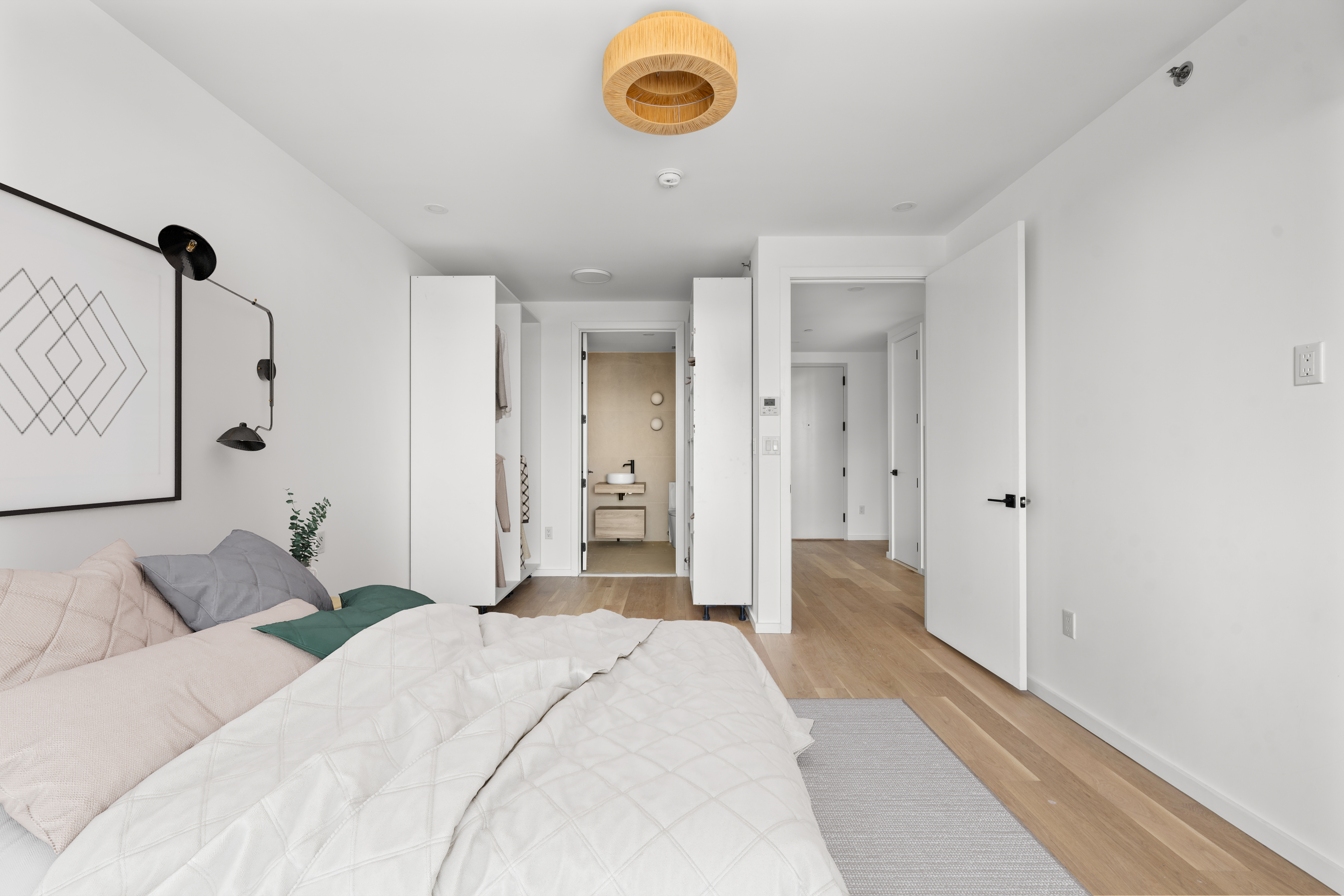 14-35 Broadway, Unit 1A Queens, NY 11106 - Photo 11 of 20 a bedroom with a bed and a window