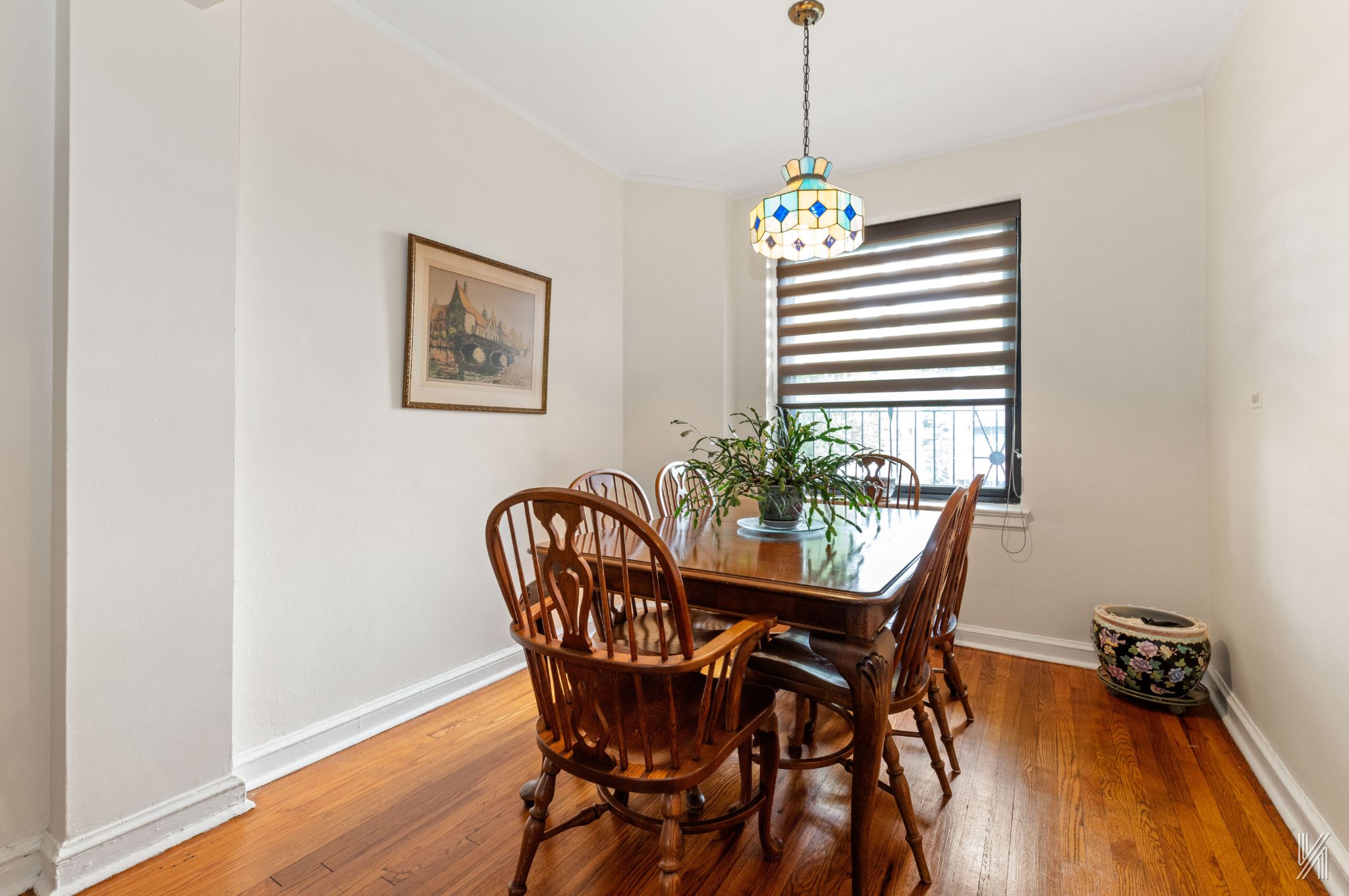 22-08 76th Street, Unit D2 Queens, NY 11370 - Photo 8 of 20 a dining room with furniture and wooden floor