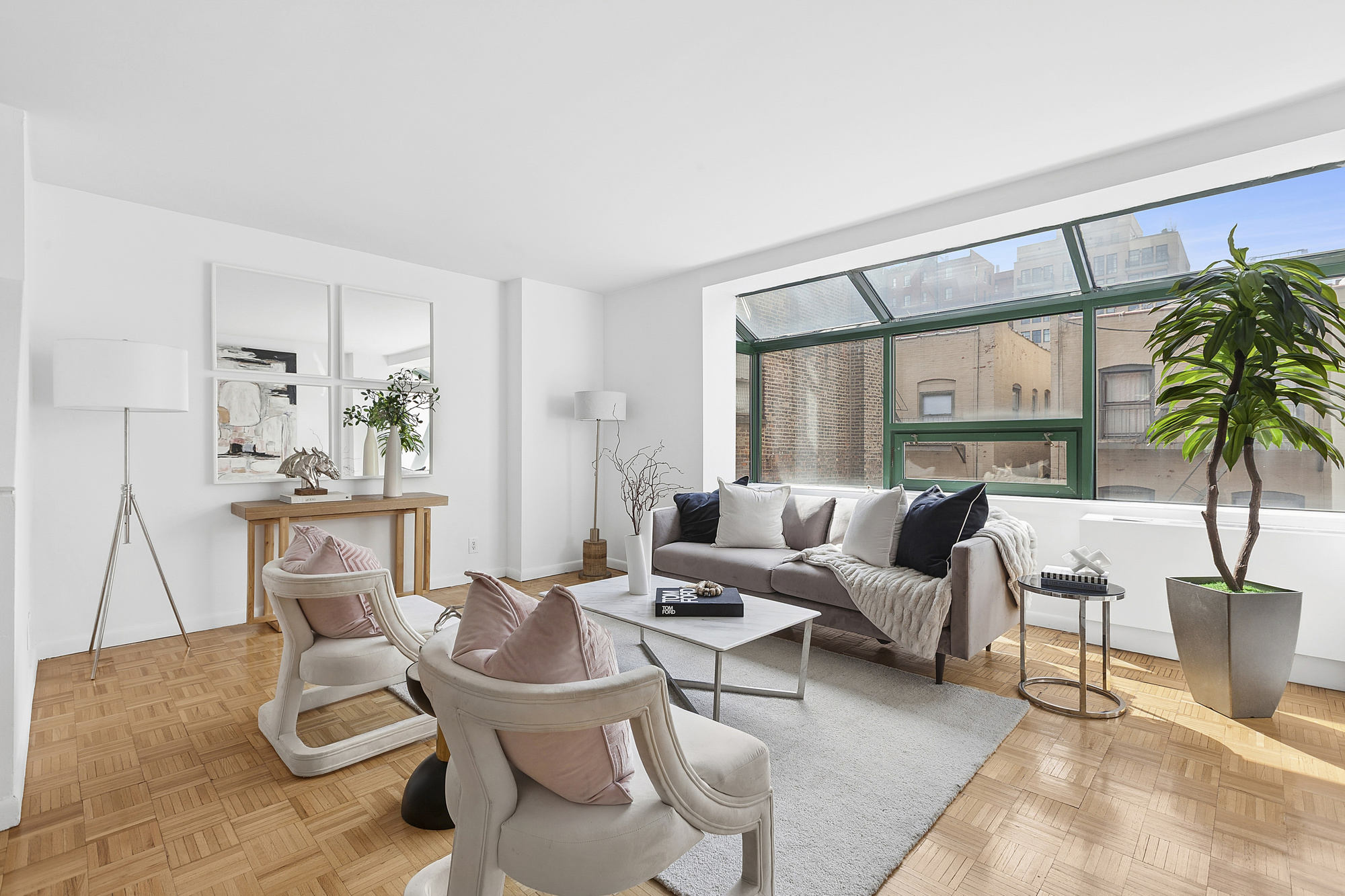 2250 Broadway, Unit 6K Manhattan, NY 10024 - Photo 1 of 13 a living room with furniture and a large window