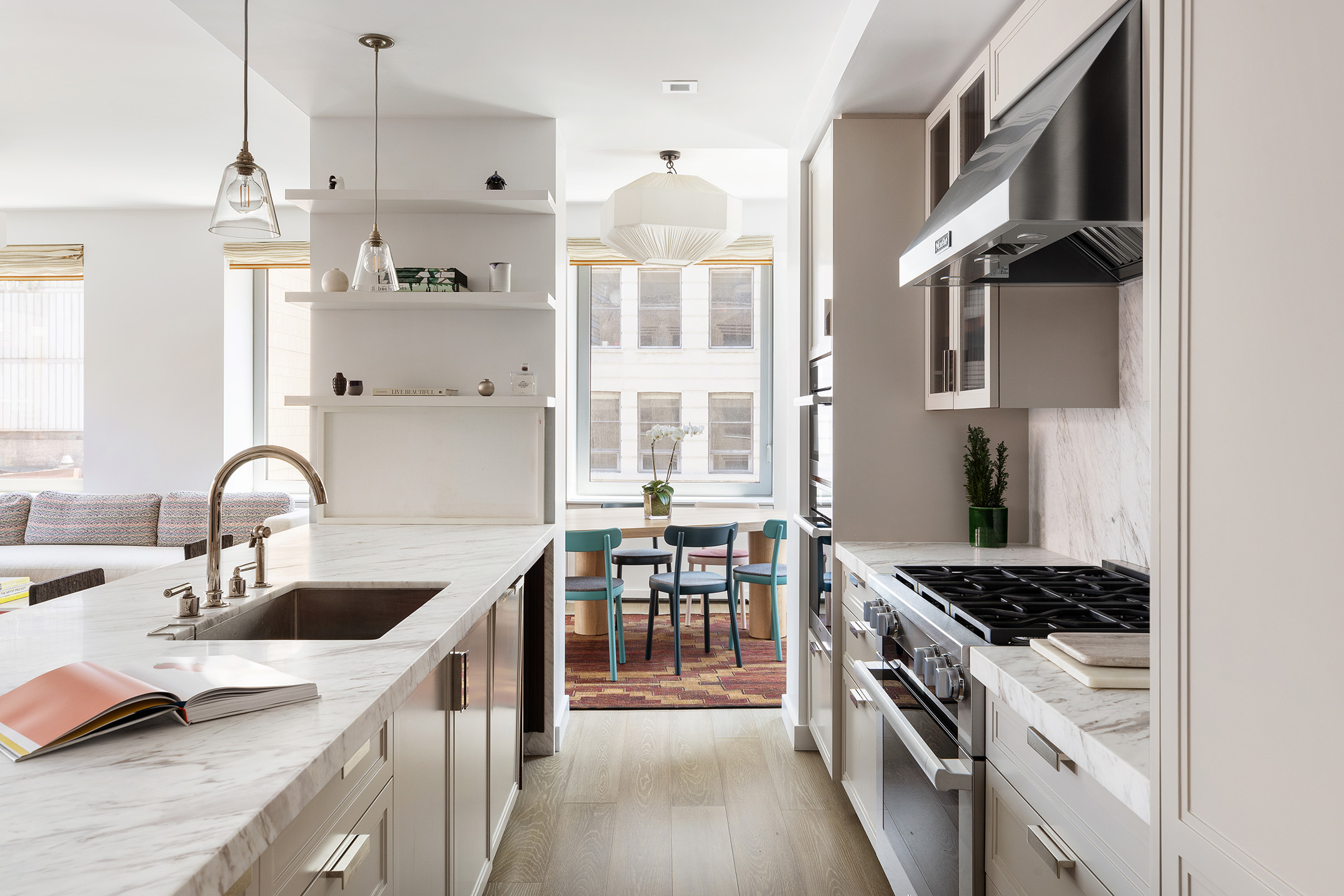 116 University Place, Unit 5 Manhattan, NY 10003 - Photo 7 of 19 a kitchen with stainless steel appliances granite countertop a sink stove and refrigerator