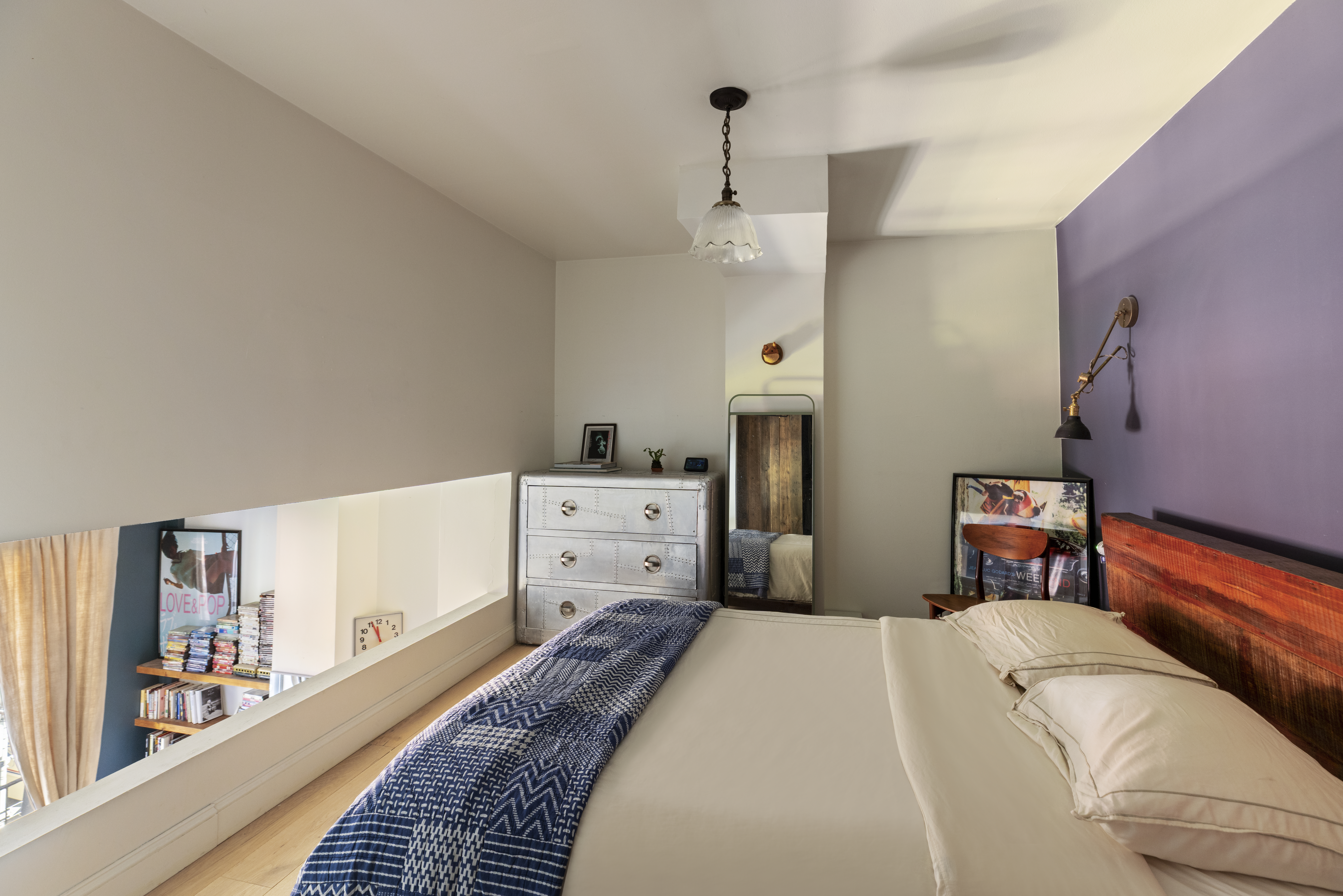 160 East 26th Street, Unit 4B Manhattan, NY 10010 - Photo 5 of 7 a bed room with a bed and a chandelier