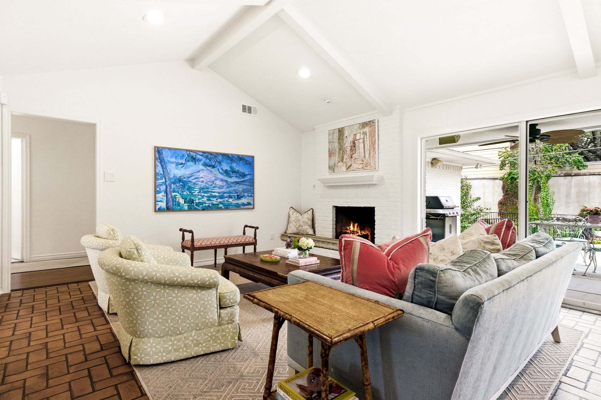 5765 Stonegate Road Dallas, TX 75209 - Photo 10 of 37 a living room with furniture a large window and a fireplace