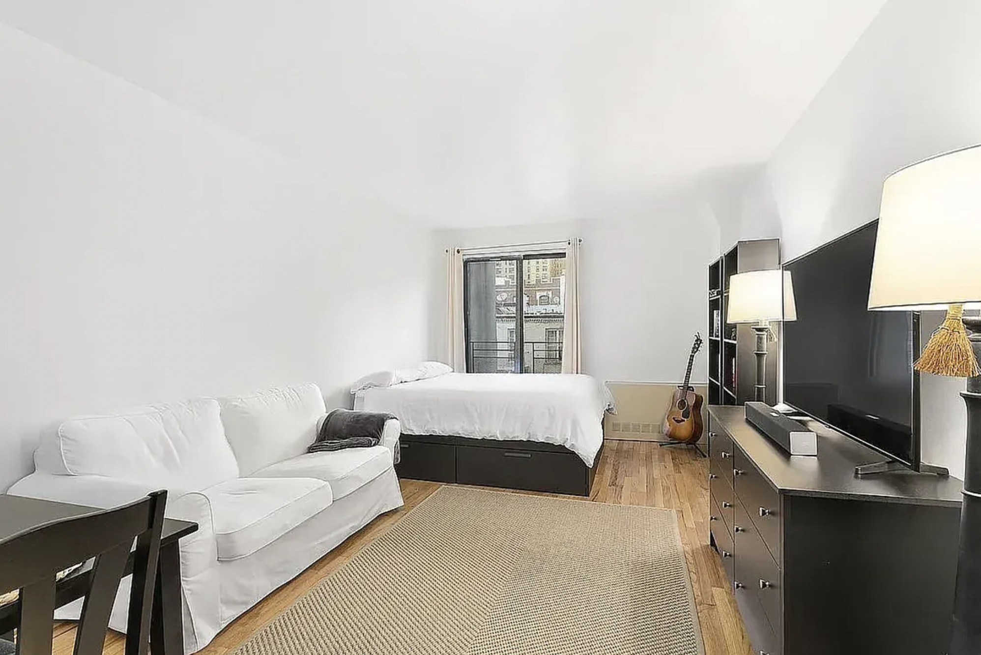 a bedroom with a bed and a lamp