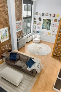 a living room with furniture and flat screen tv