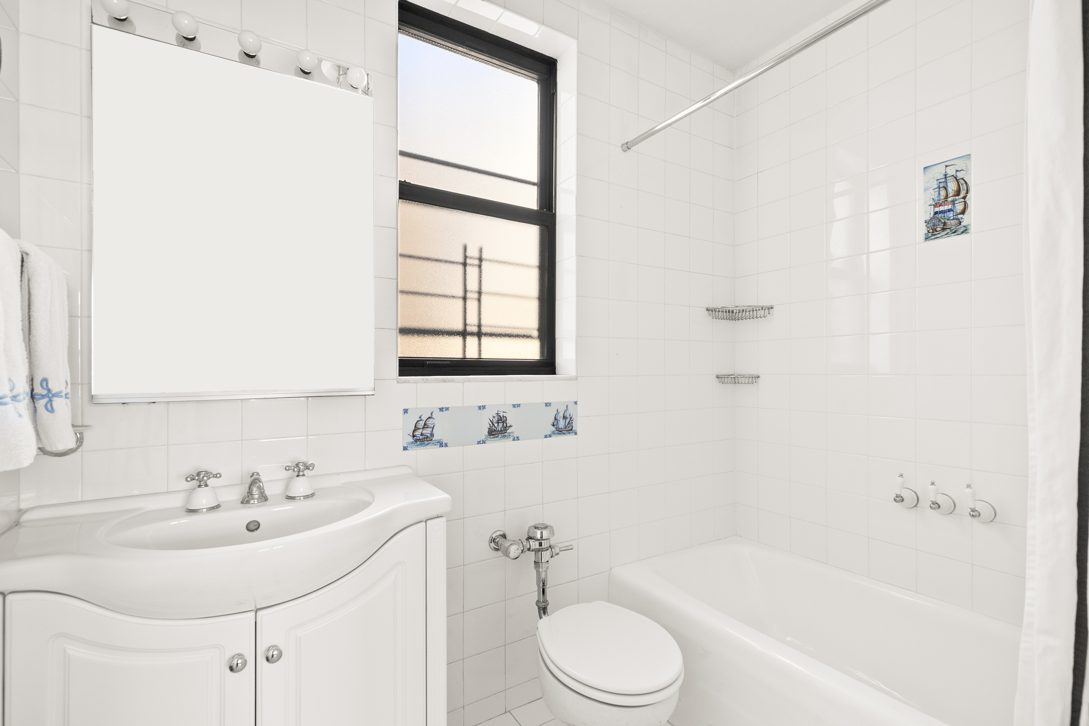 410 East 57th Street, Unit 15B Manhattan, NY 10022 - Photo 10 of 17 a bathroom with a sink toilet and shower