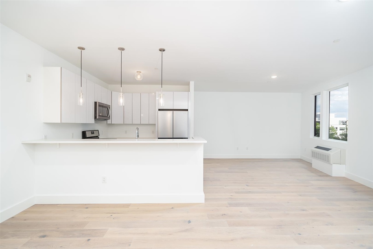 8621 River Road, Unit 6D North Bergen, NJ 07047 - Photo 4 of 36 a view of kitchen with stainless steel appliances granite countertop refrigerator sink and stove