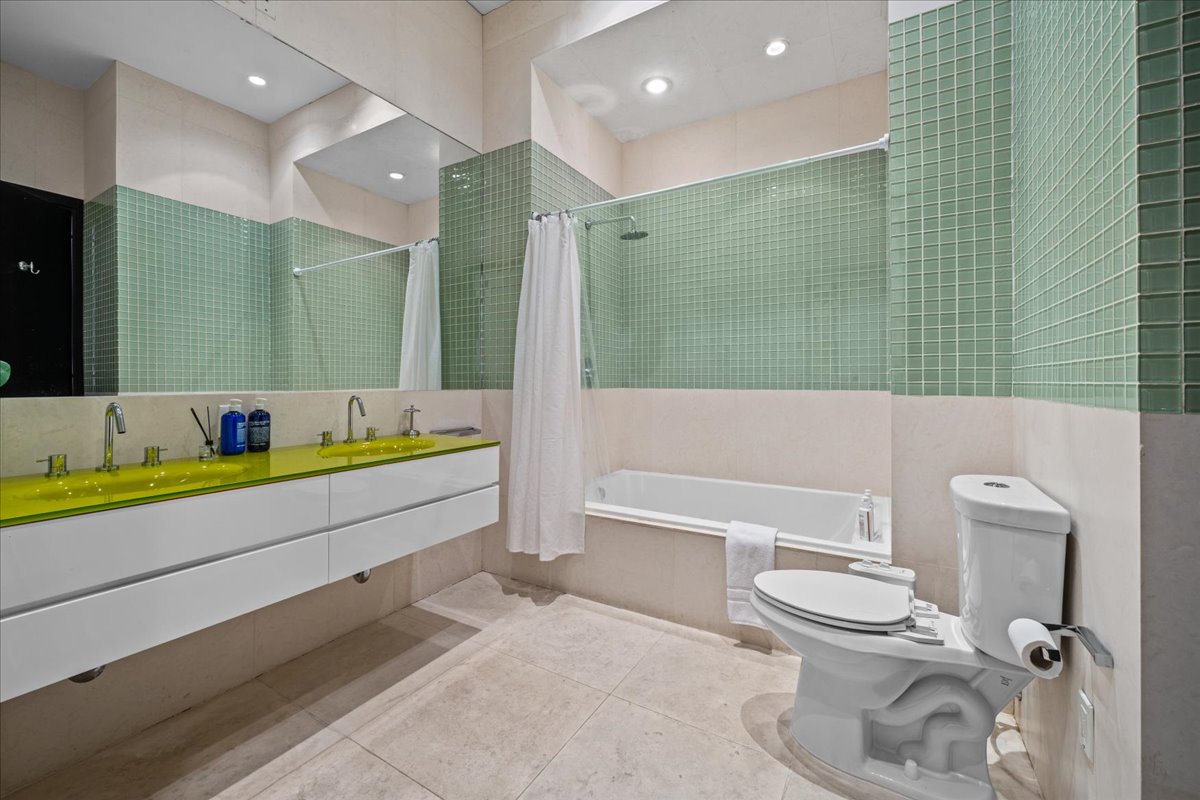 133 West 14th Street, Unit 1 Manhattan, NY 10011 - Photo 12 of 17 a bathroom with a bathtub and a toilet