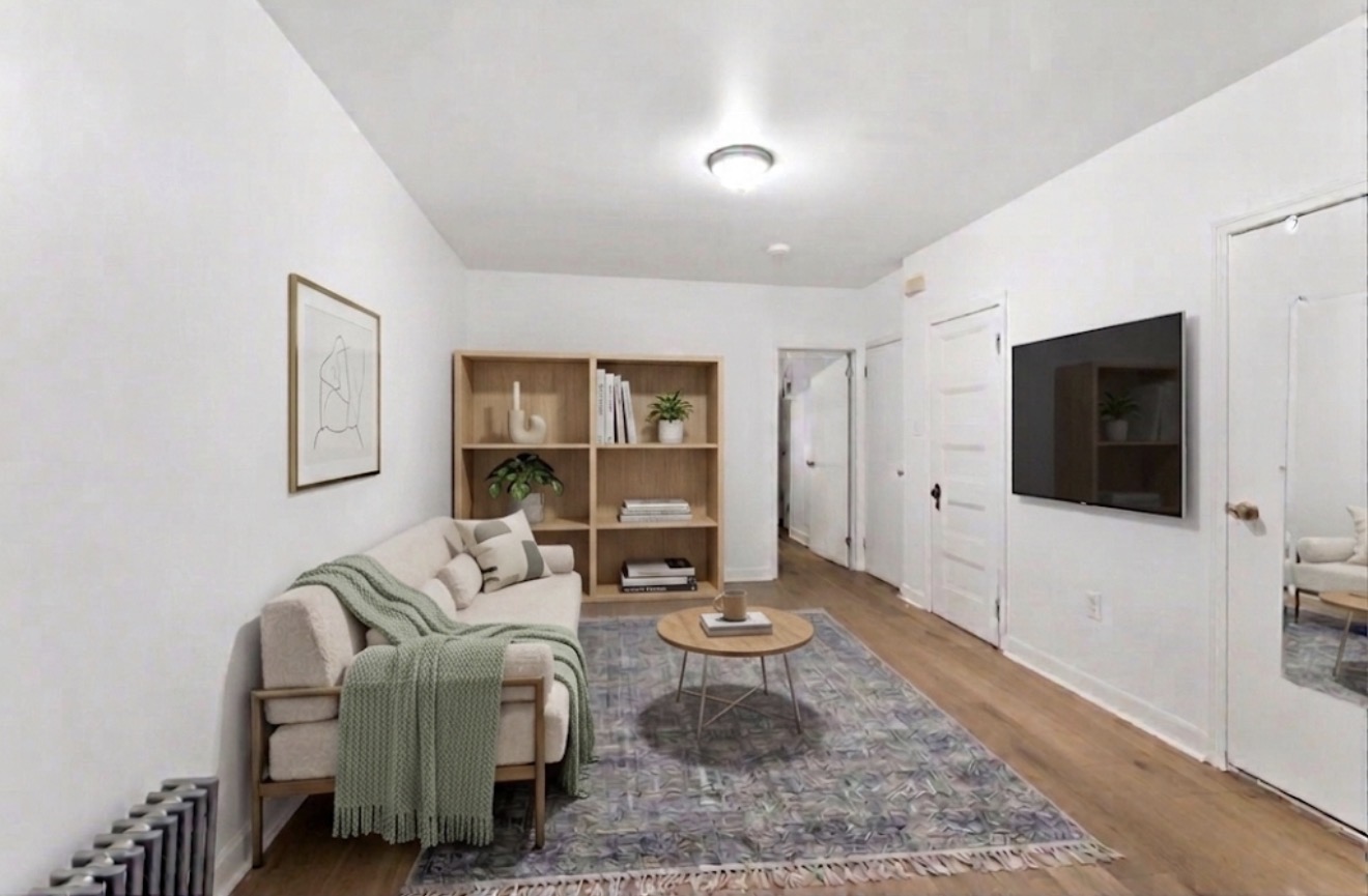 281 6th Street, Unit 1 Brooklyn, NY 11215 - Photo 2 of 7 a living room with furniture and a flat screen tv