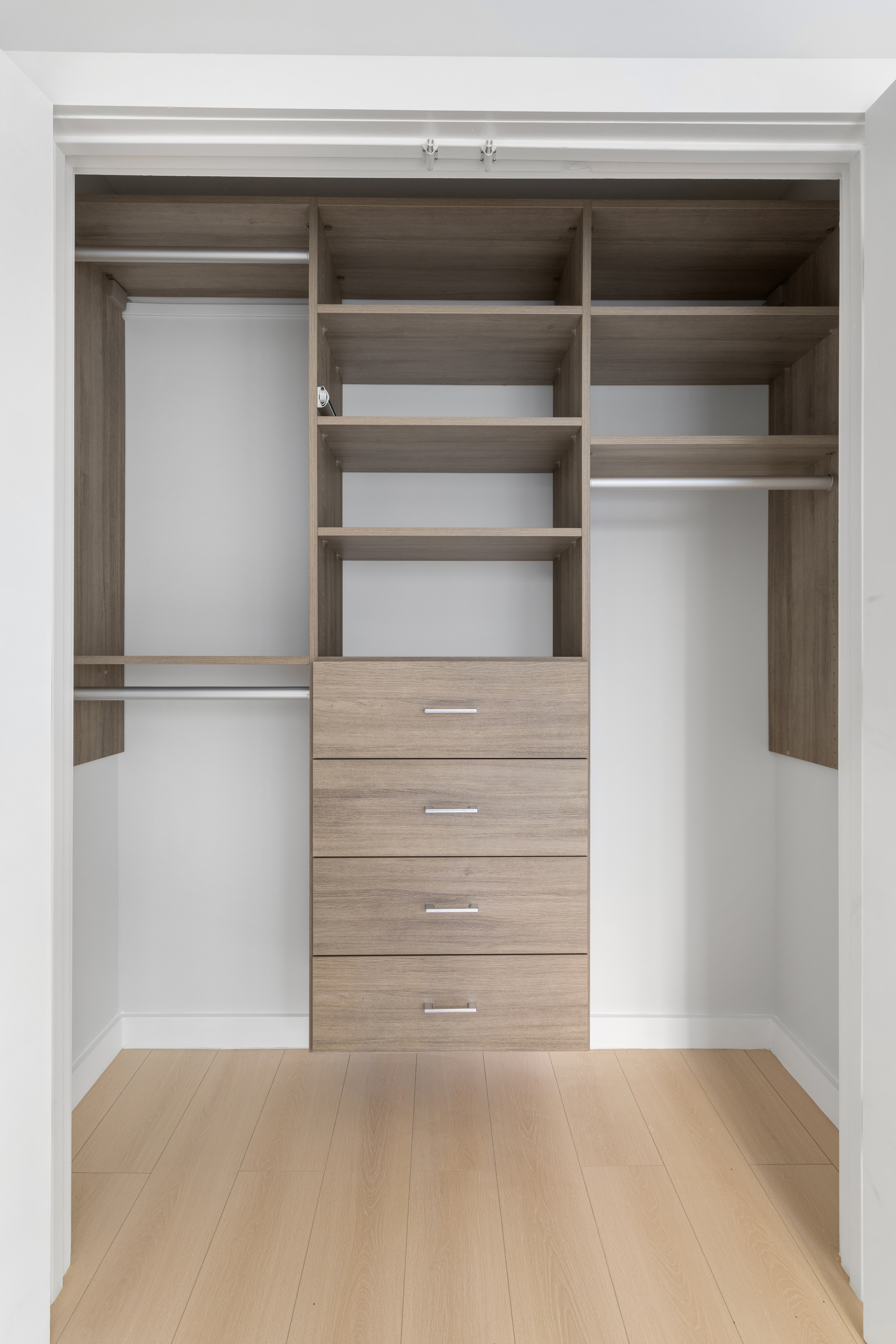 227 East 21st Street, Unit 2R Manhattan, NY 10010 - Photo 9 of 12 a view of walk in closet with empty racks