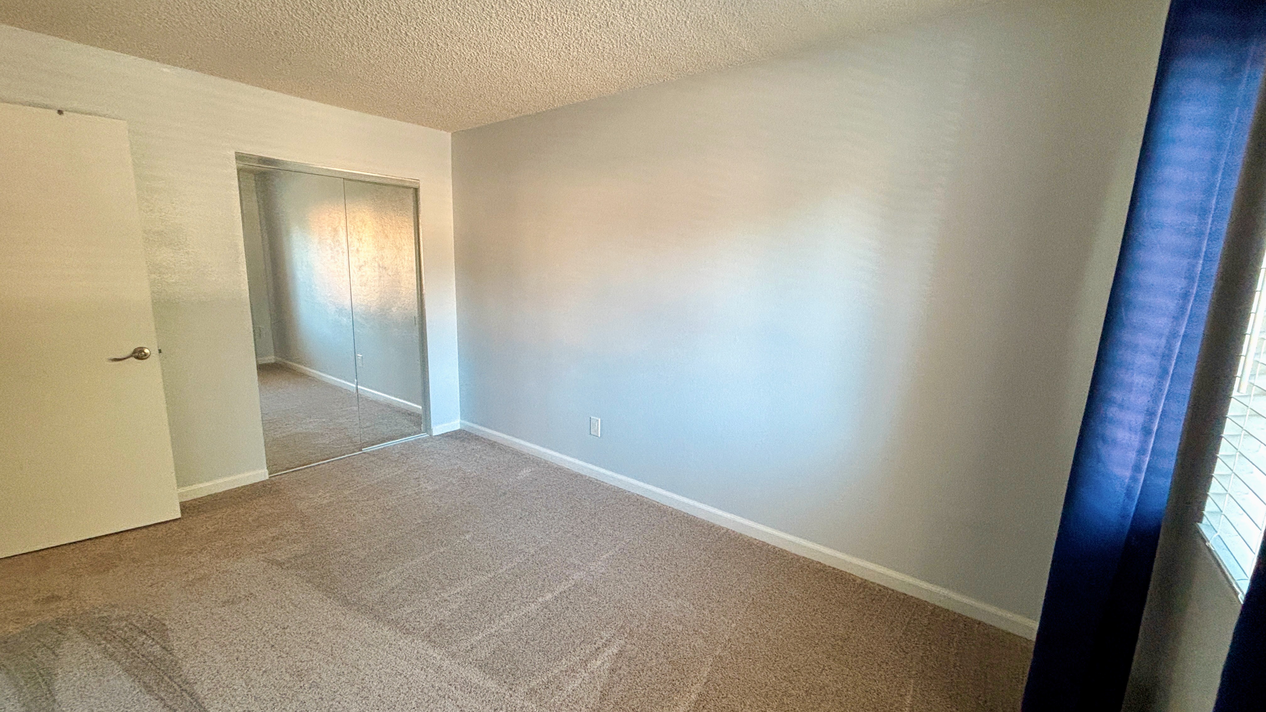 1749 Las Raposas Court Santa Rosa, CA 95409 - Photo 3 of 11 an empty room with closet and mirror