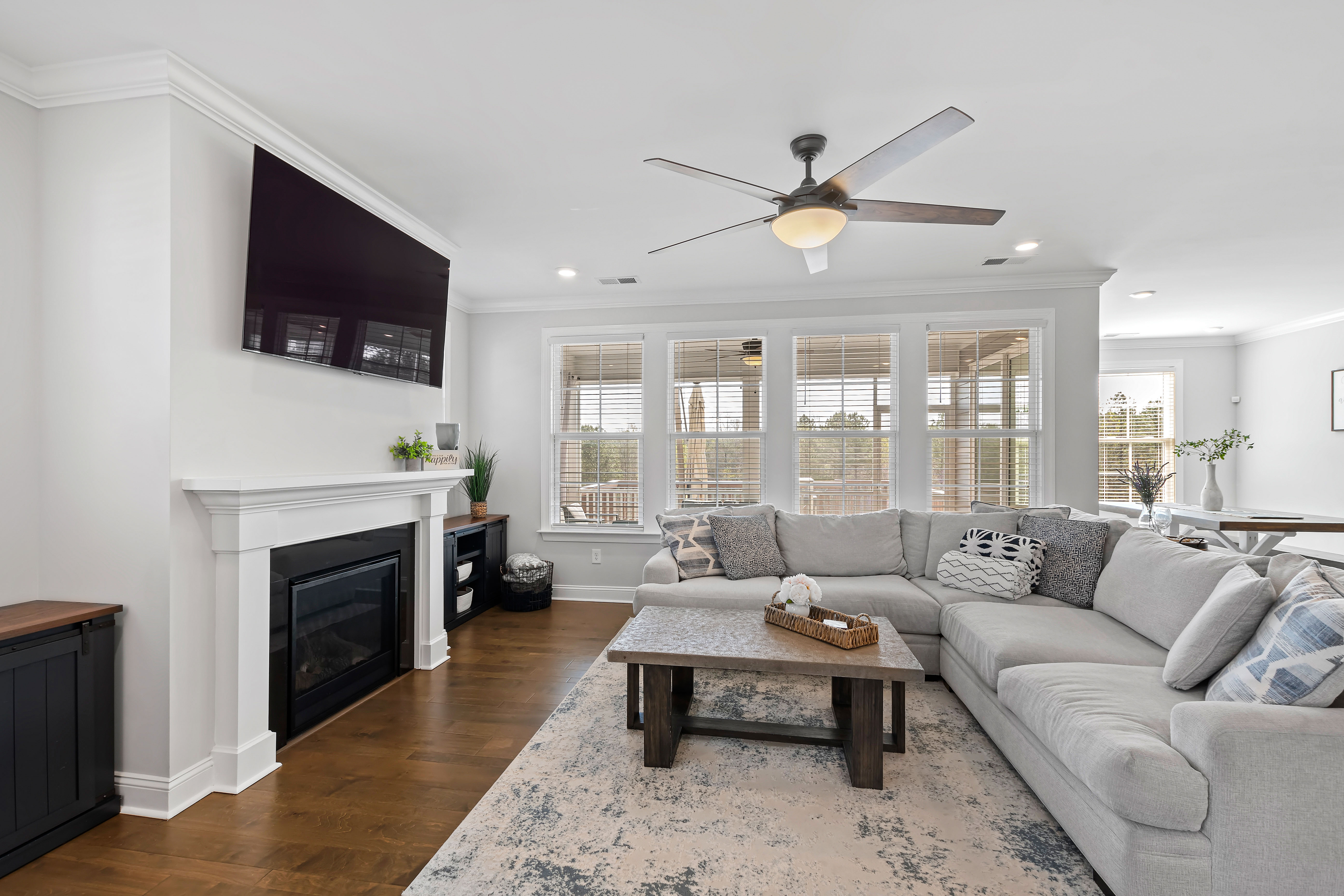 199 High Woods Rdg Pittsboro, NC 27312 - Photo 7 of 10 a living room with furniture a flat screen tv and a fireplace