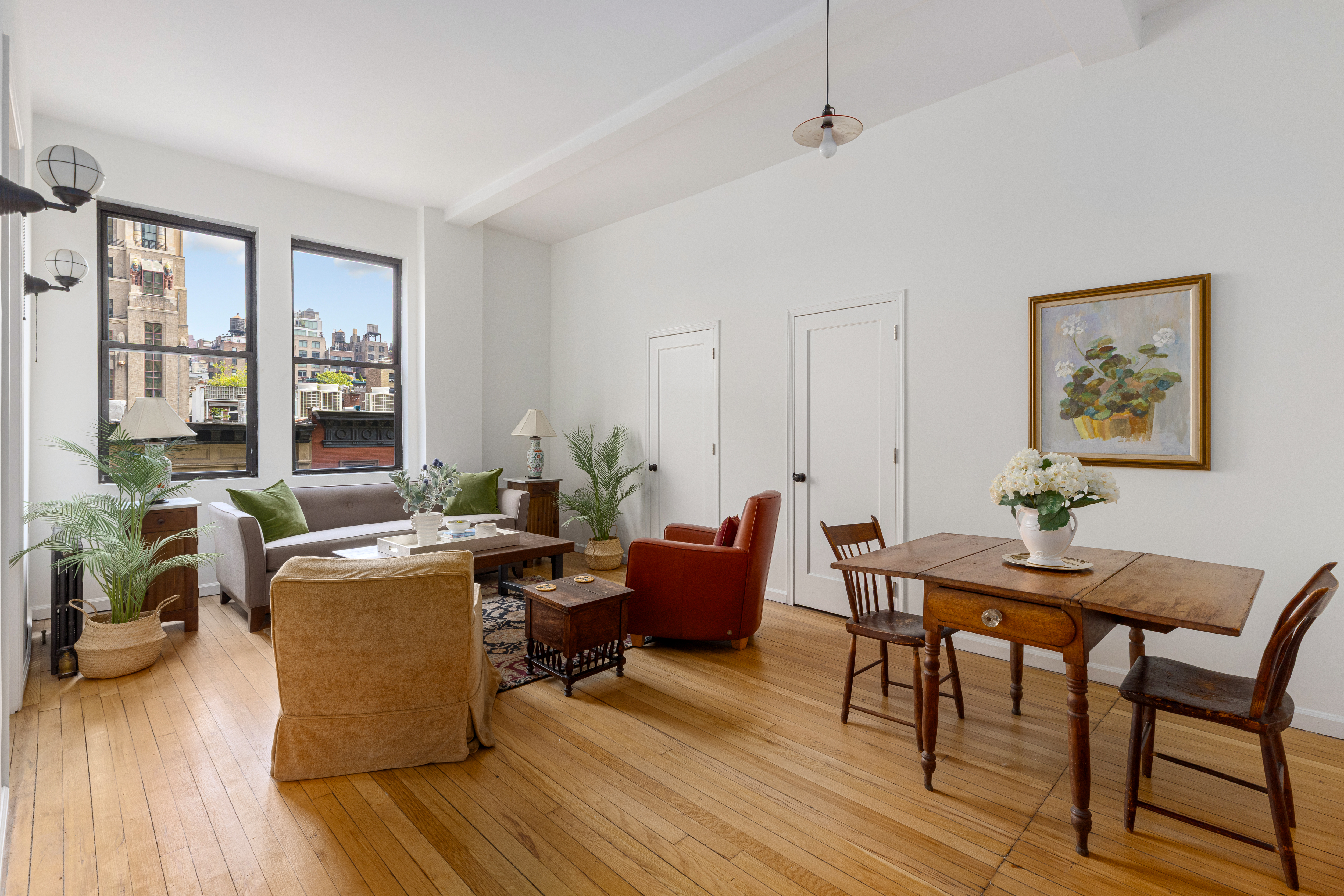 140 West 69th Street, Unit 56A Manhattan, NY 10023 - Photo 2 of 9 a view of a livingroom and dining room
