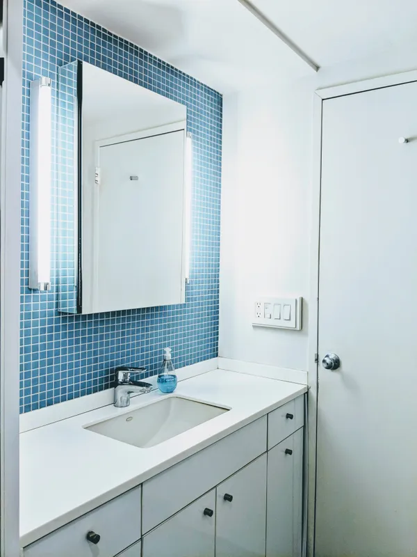 a bathroom with a sink and a mirror