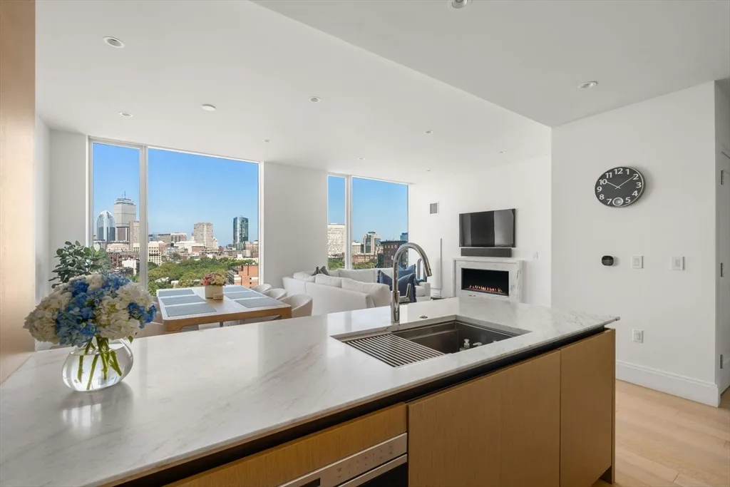 a view of kitchen island a sink and living room