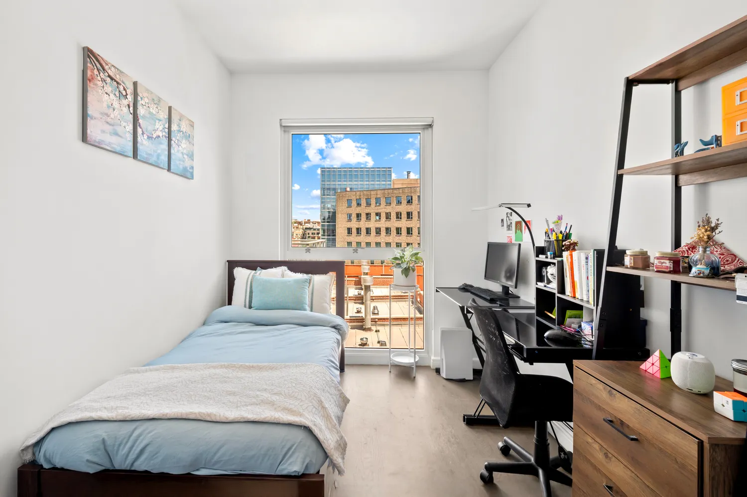 a bedroom with a large bed and a desk