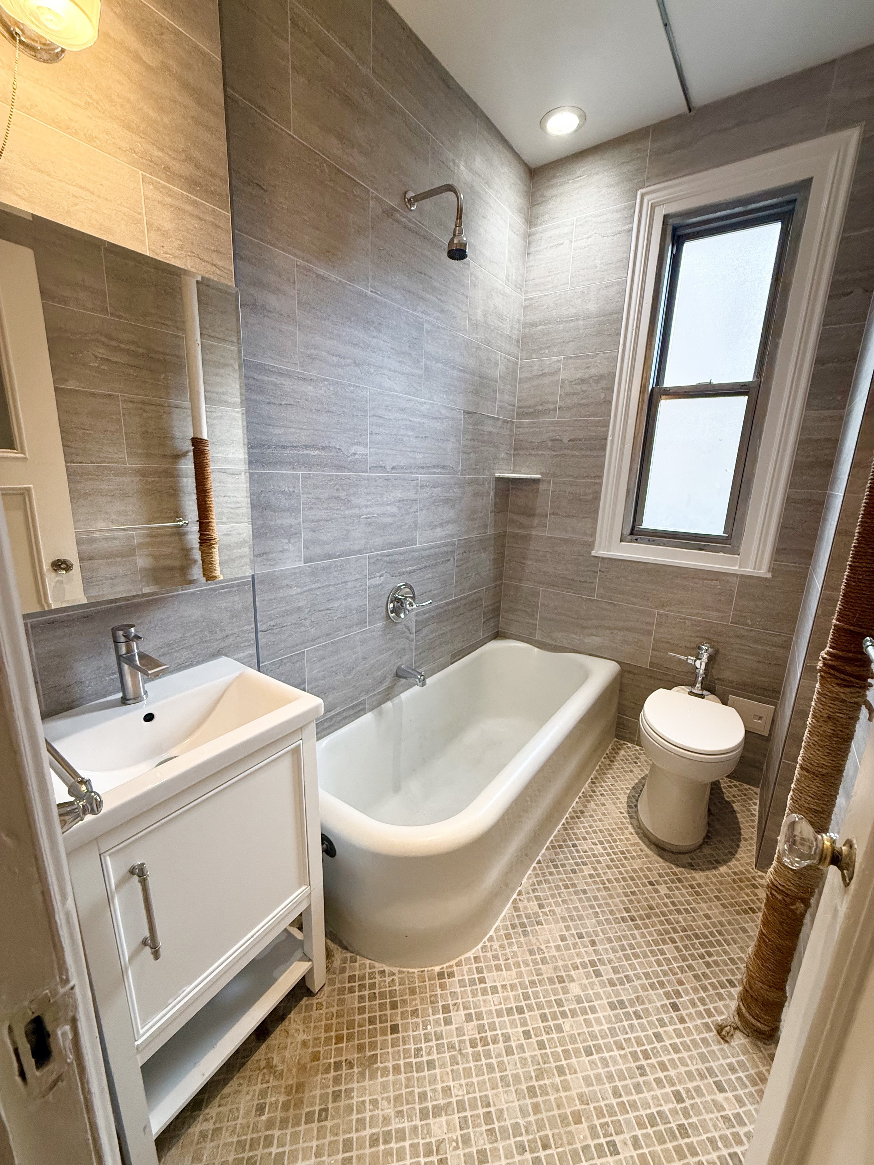 170 Claremont Avenue, Unit 19 Manhattan, NY 10027 - Photo 8 of 9 a bathroom with a sink and a mirror
