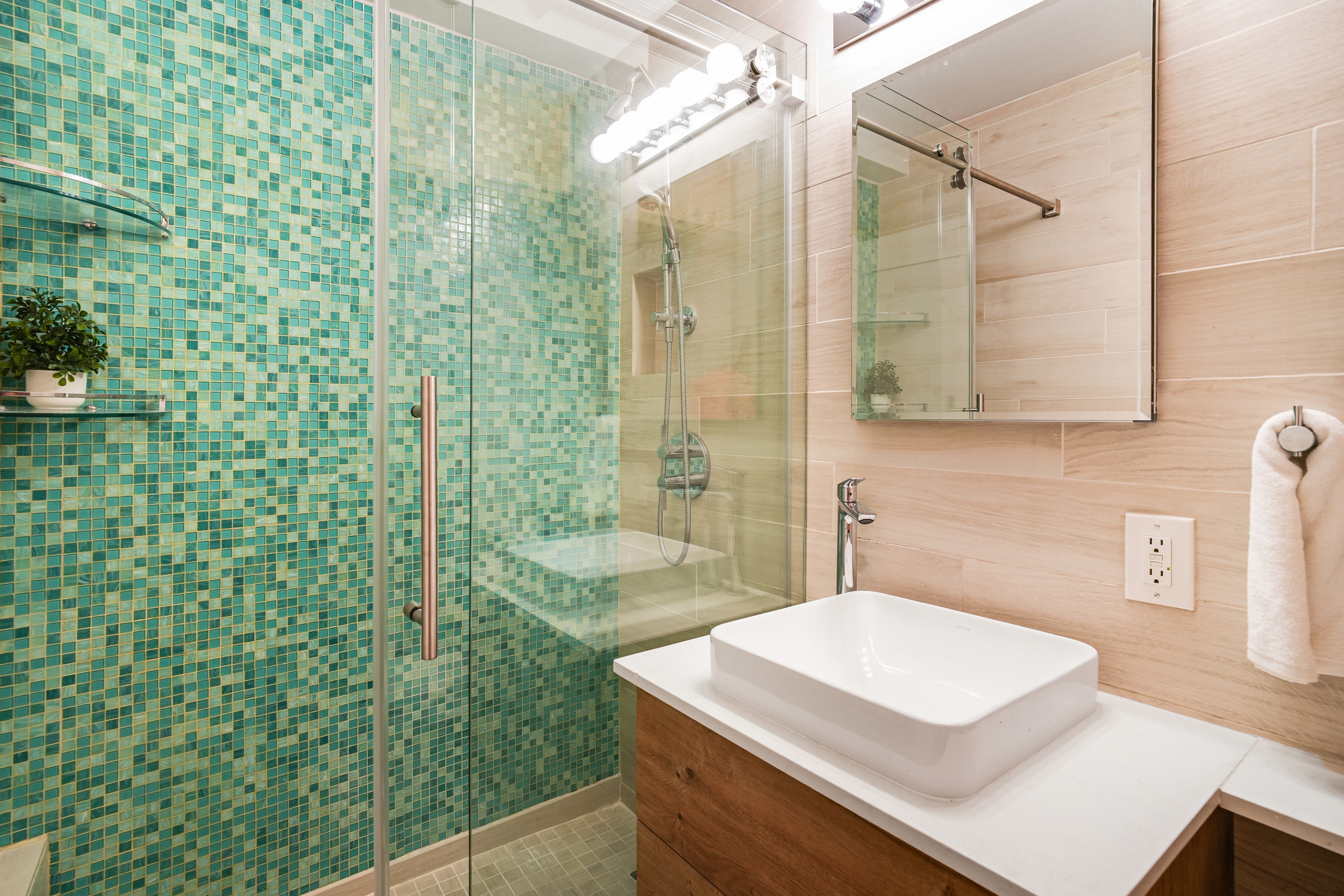 31 Jane Street, Unit 10FG Manhattan, NY 10014 - Photo 15 of 27 a bathroom with a sink a toilet and shower