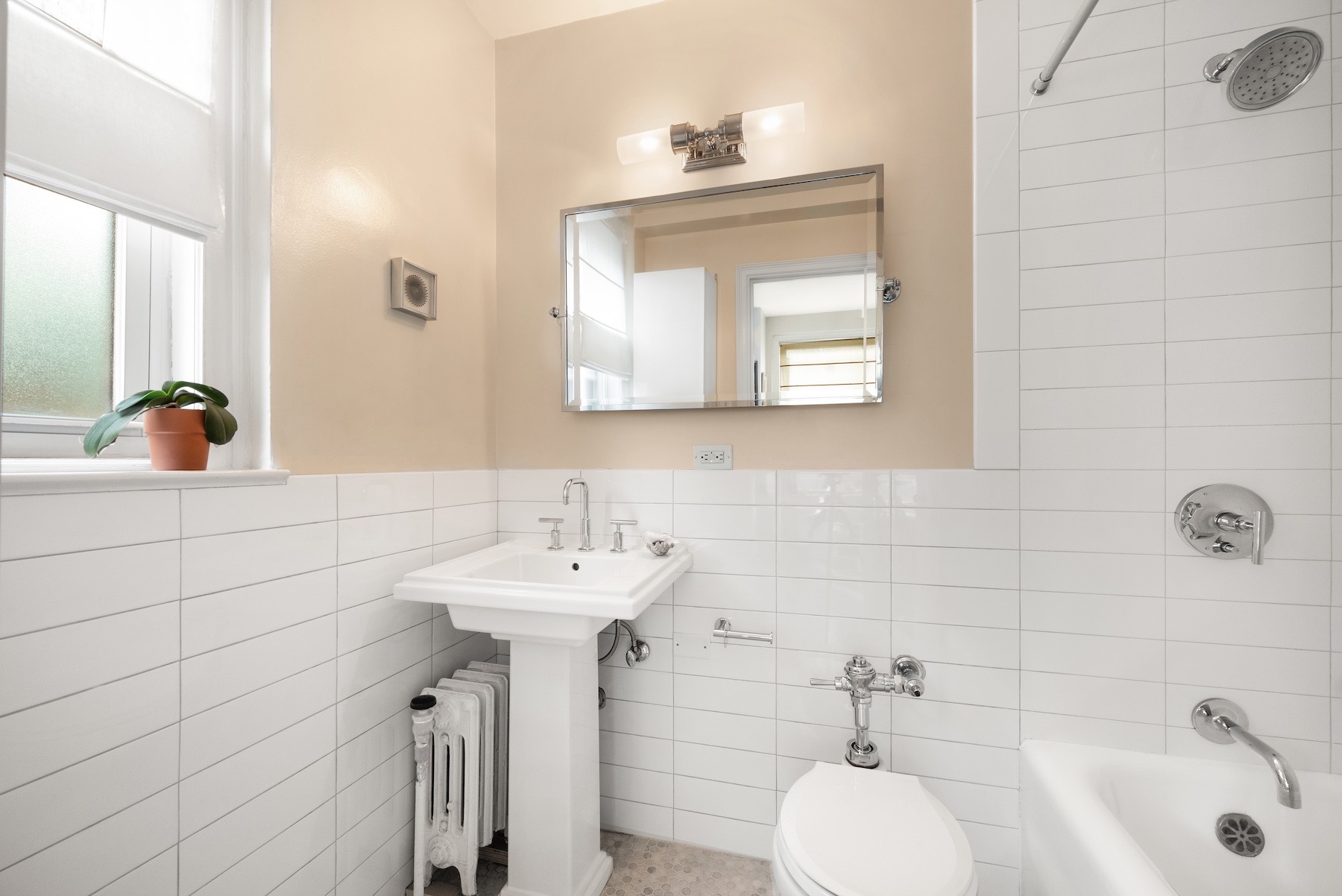 400 East 59th Street, Unit 3G Manhattan, NY 10022 - Photo 5 of 7 a bathroom with a sink and a bathtub