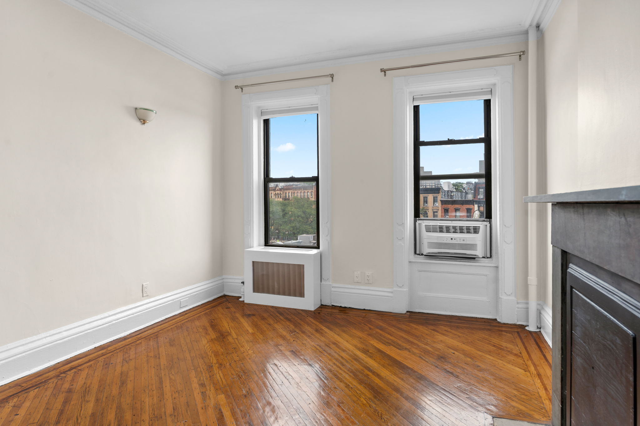149 Sterling Place, Unit 4 Brooklyn, NY 11217 - Photo 3 of 9 an empty room with windows and closet